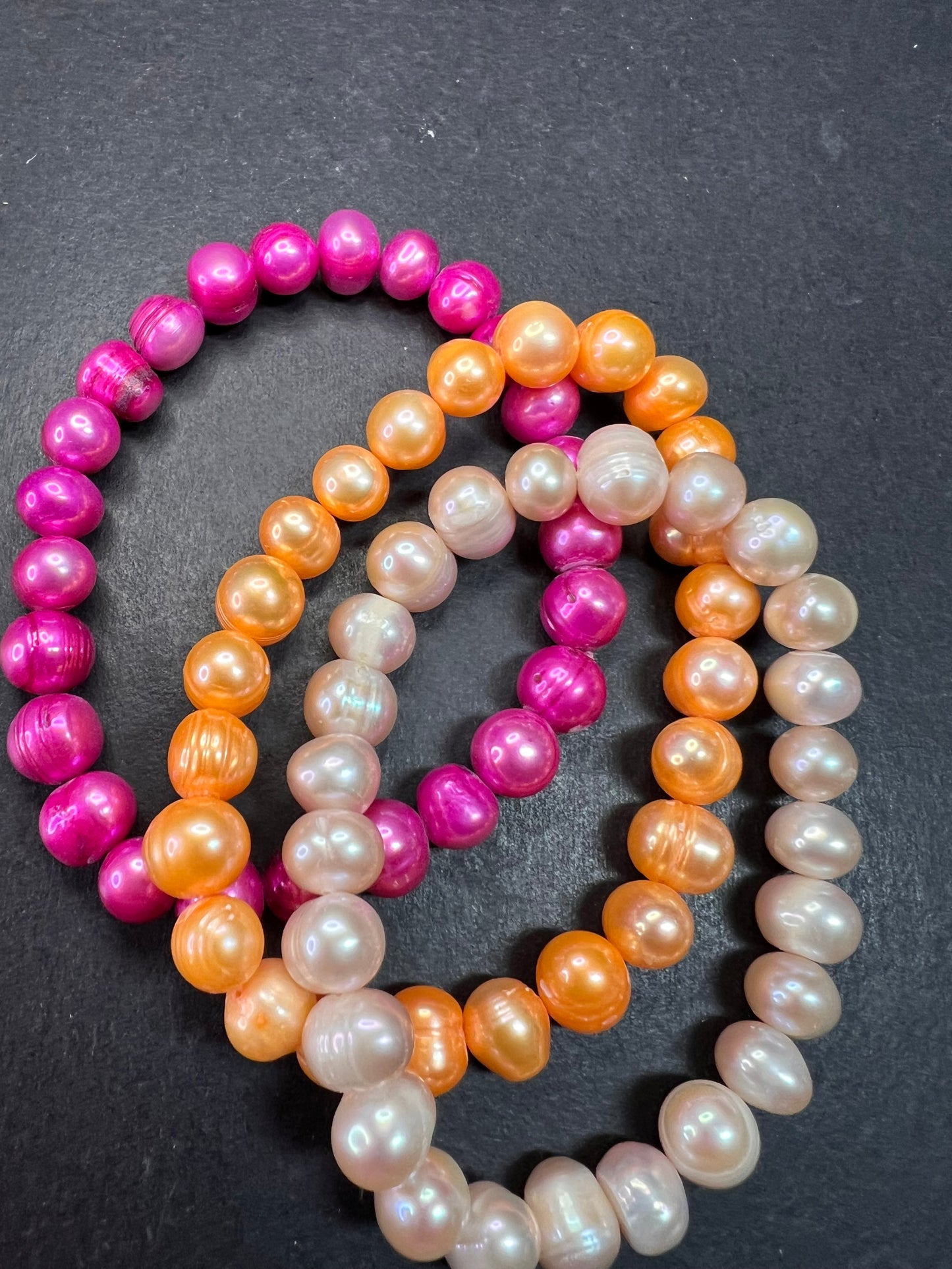 Set of three freshwater pearl stretch bracelets fuchsia pink to tangerine