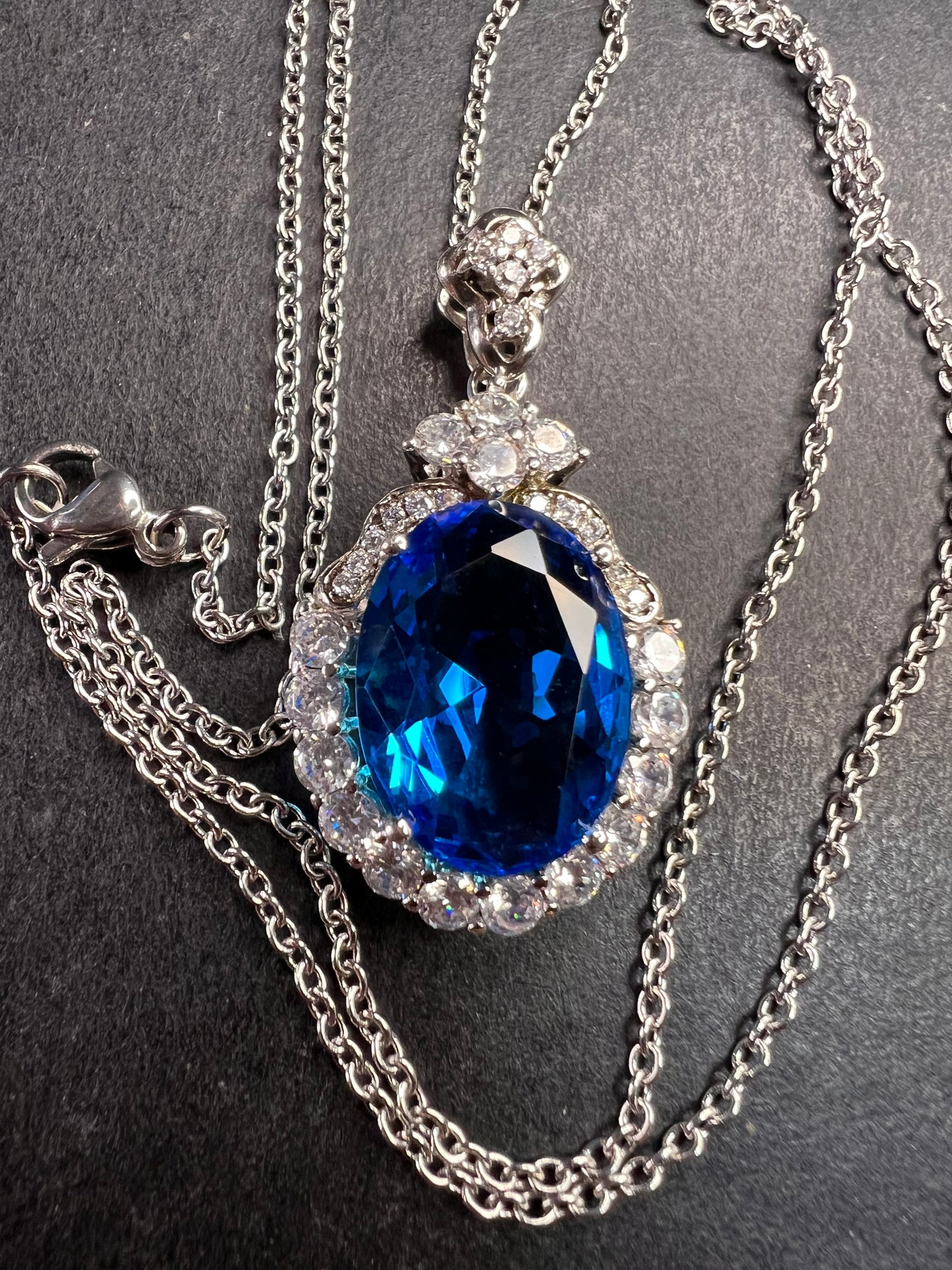 Blue and white CZ sterling silver halo pendant