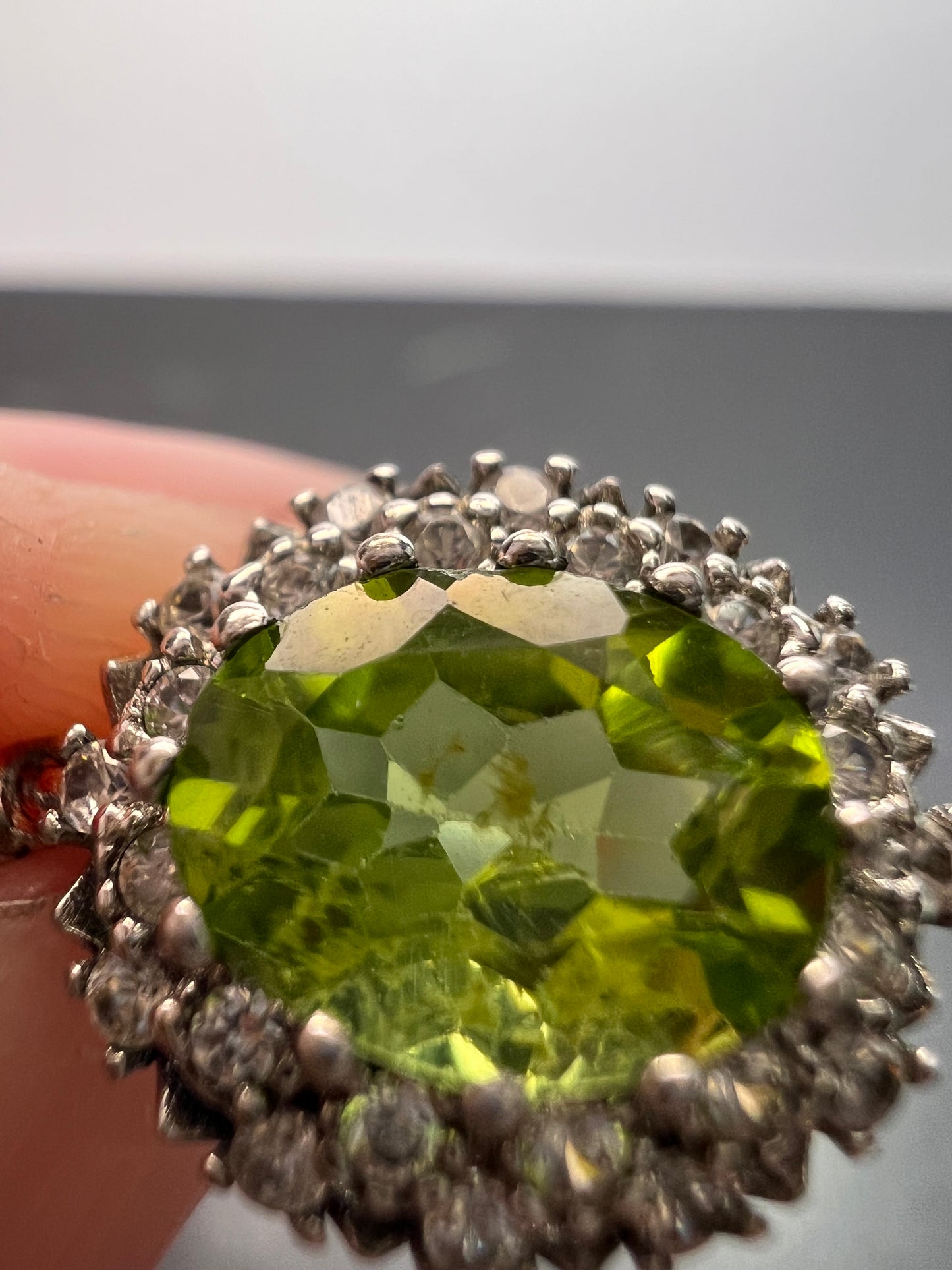 Manchurian Peridot and zircon drop halo earrings in rhodium over sterling silver 5.42 ctw