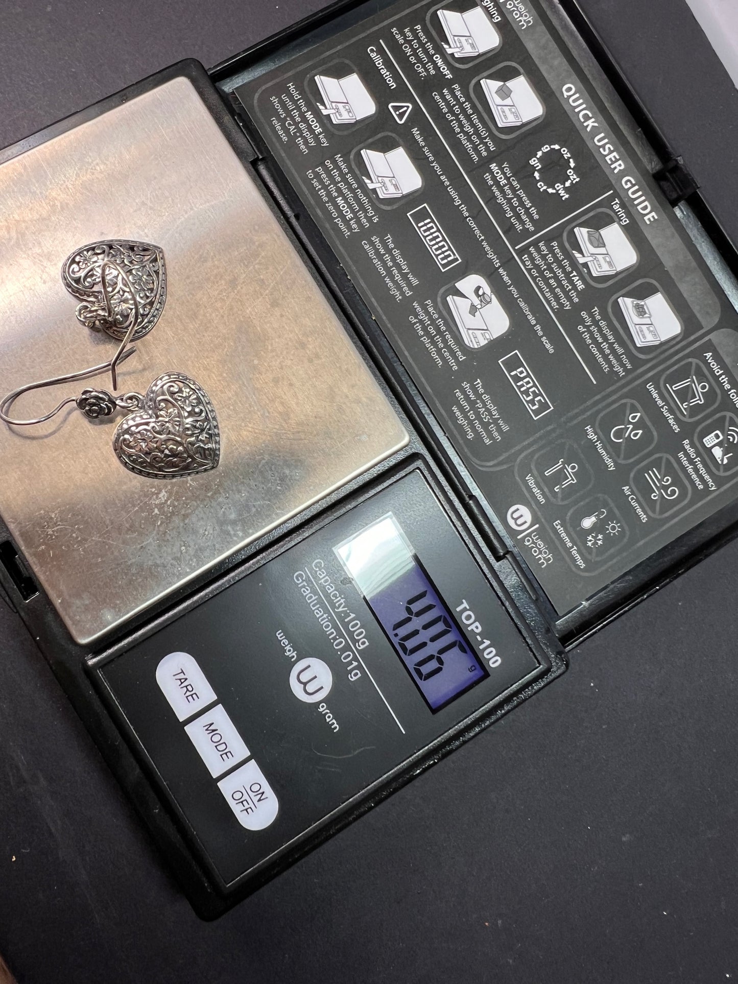 Sterling silver heart shaped earrings with floral design