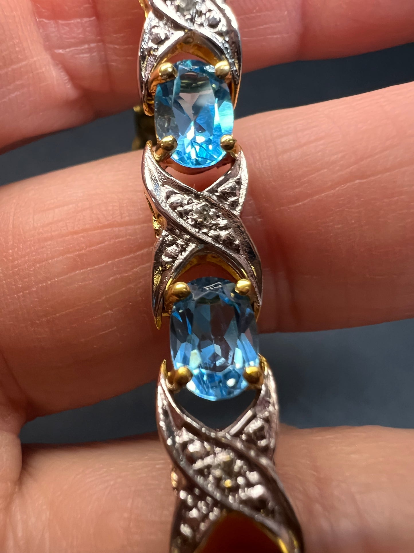 Vintage blue topaz and diamond gold over sterling silver tennis bracelet