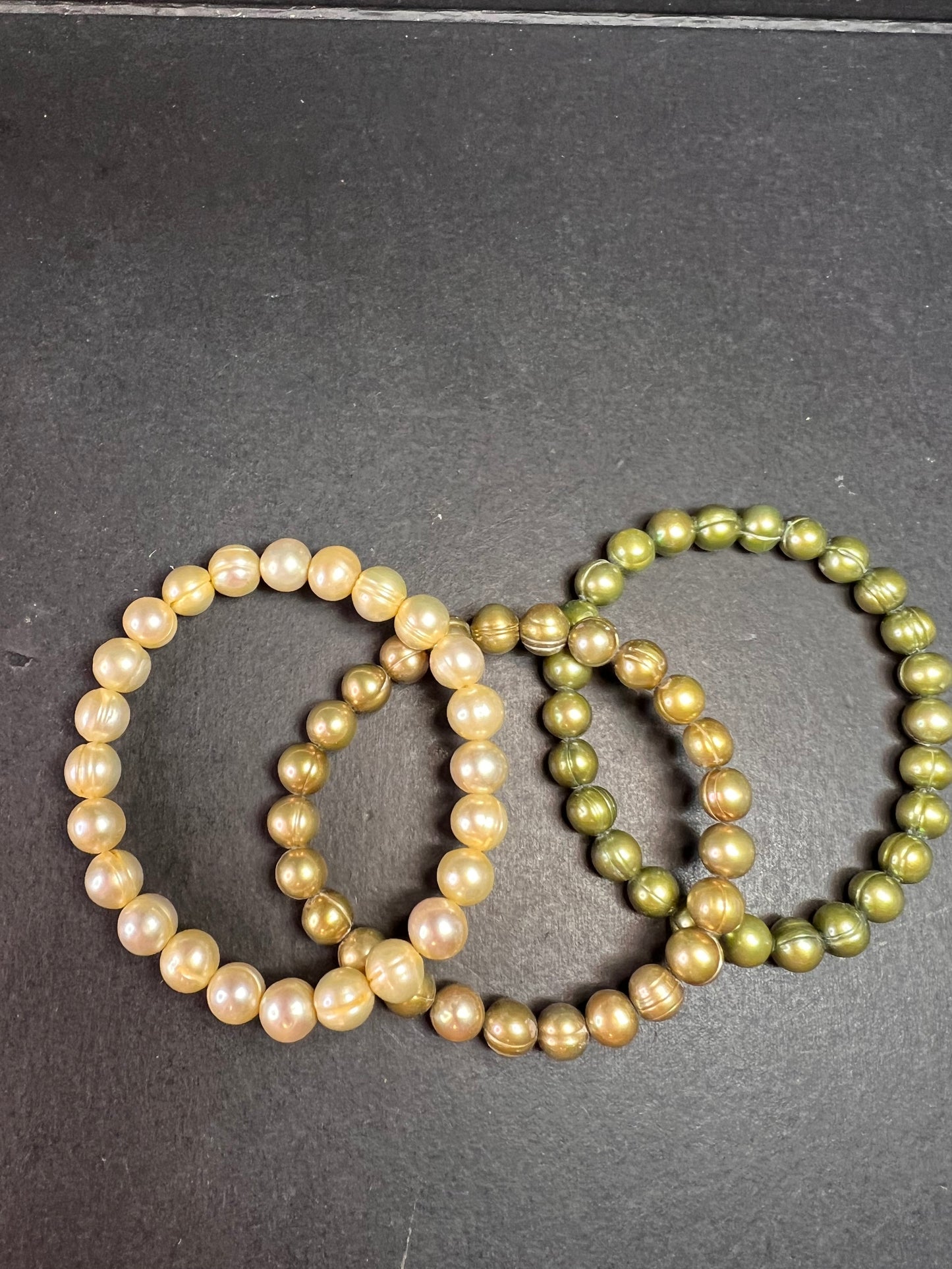Set of three freshwater pearl shades of green stretch bracelets
