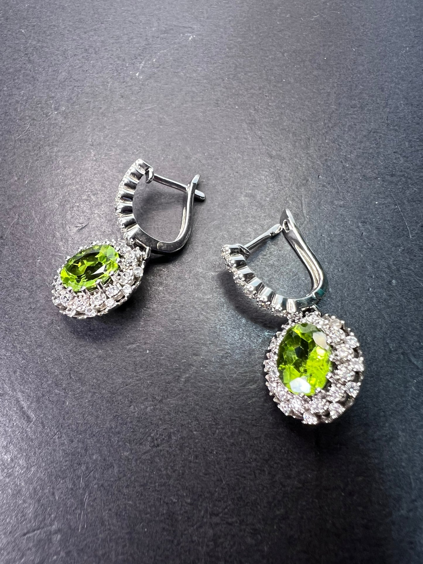 Manchurian Peridot and zircon drop halo earrings in rhodium over sterling silver 5.42 ctw