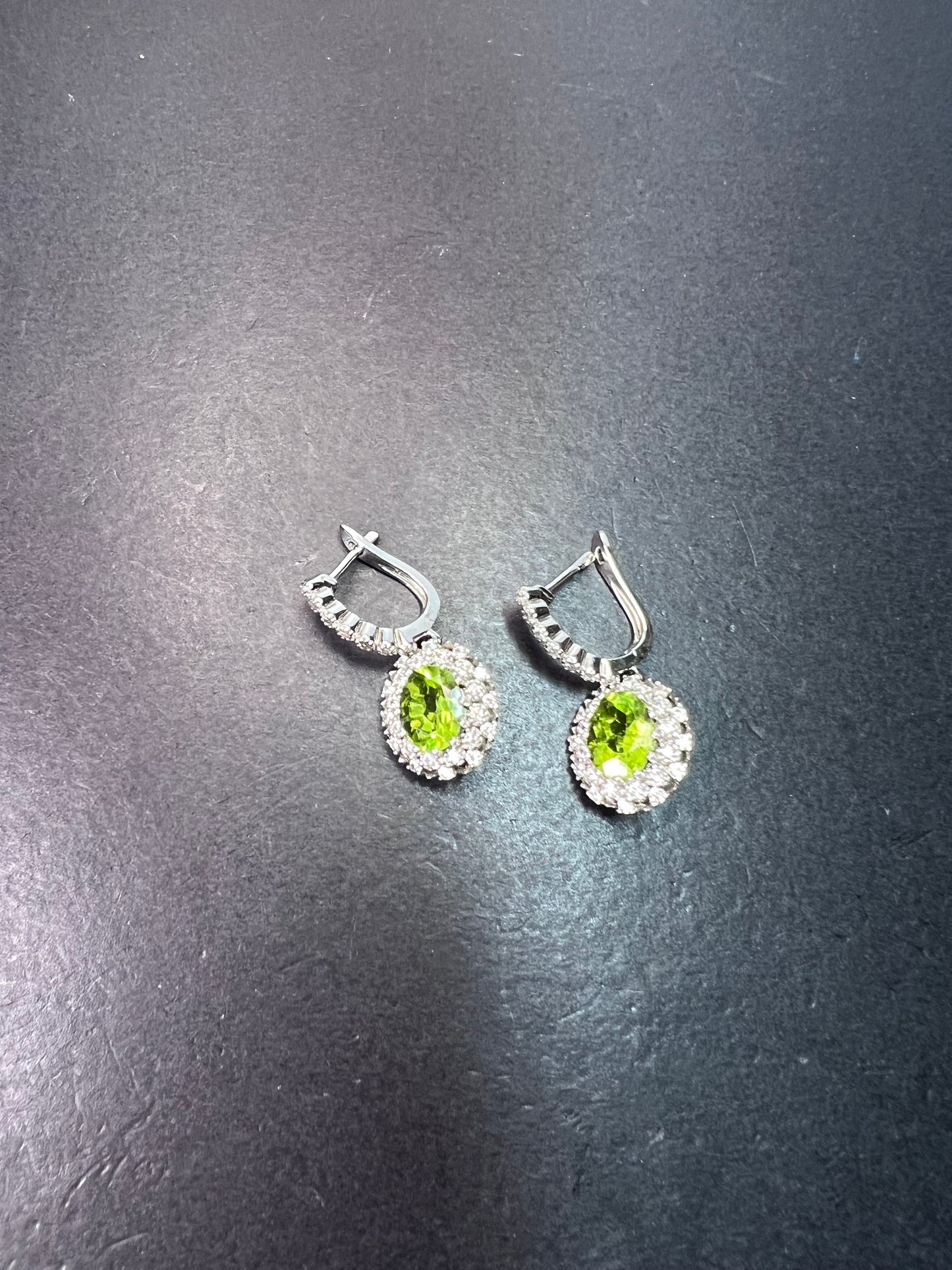 Manchurian Peridot and zircon drop halo earrings in rhodium over sterling silver 5.42 ctw