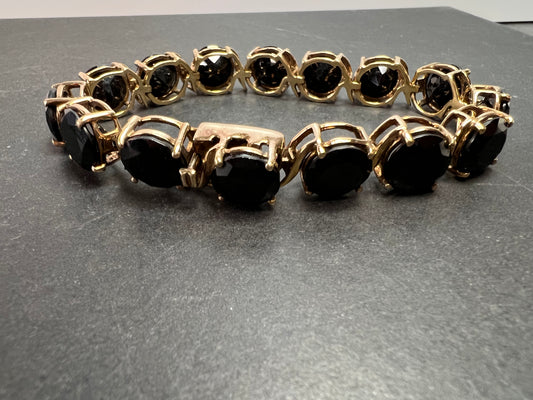 Black spinel tennis bracelet in gold over sterling silver