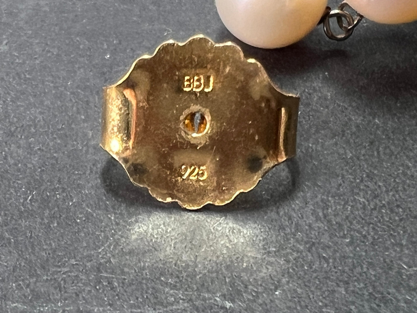 Graduated dangling pearl earrings in sterling silver