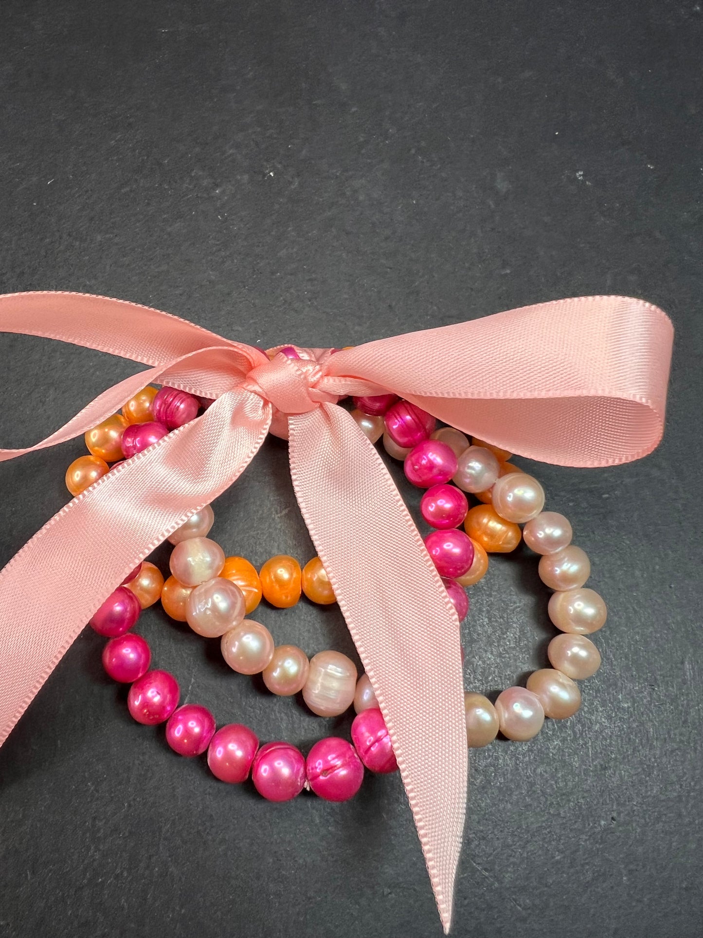 Set of three freshwater pearl stretch bracelets fuchsia pink to tangerine
