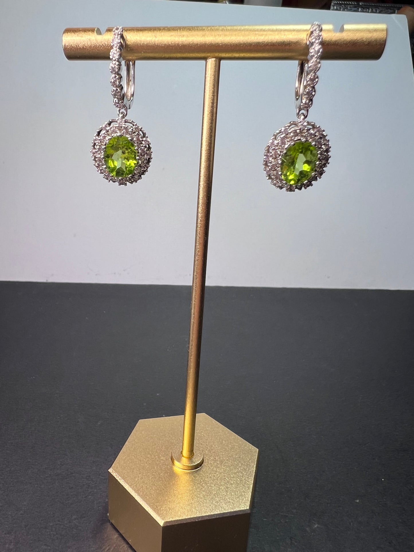 Manchurian Peridot and zircon drop halo earrings in rhodium over sterling silver 5.42 ctw