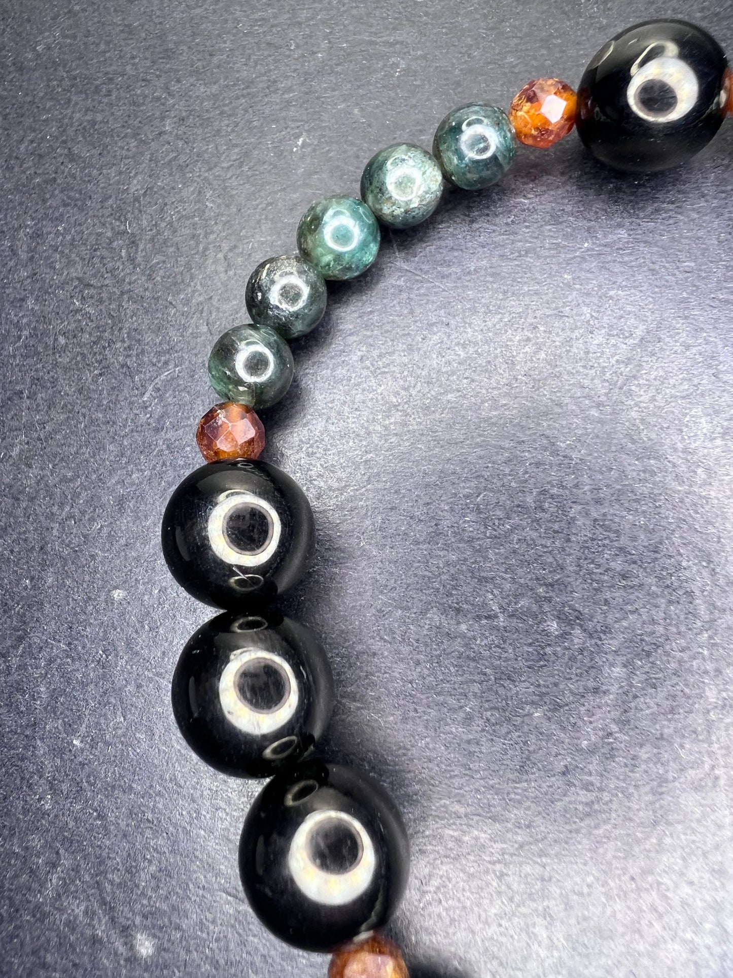 Peacock kyanite , Hessonite garnet, and jet stretch bracelet 8 inch