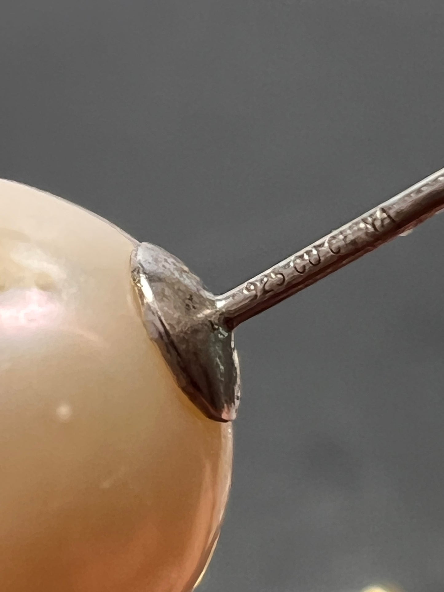 Graduated dangling pearl earrings in sterling silver