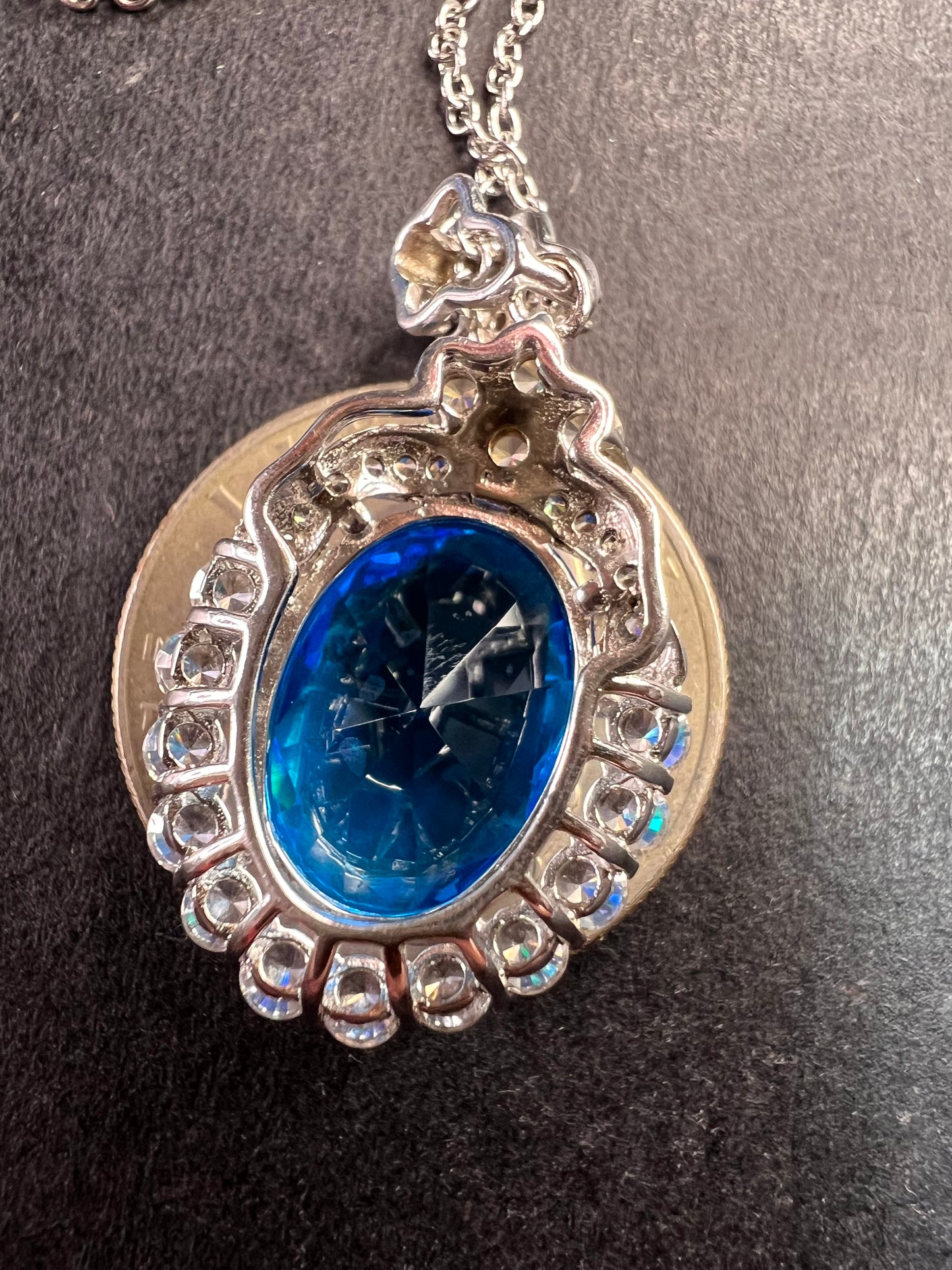 Blue and white CZ sterling silver halo pendant