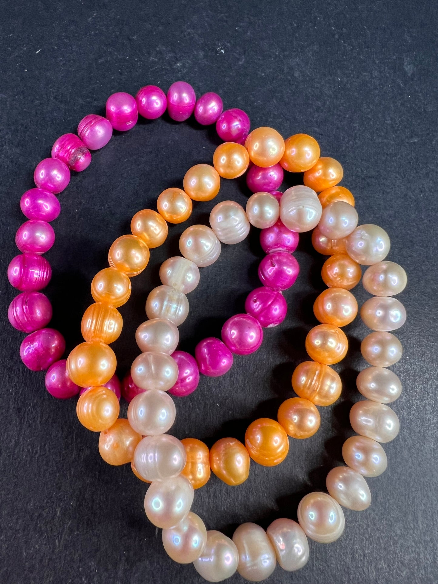 Set of three freshwater pearl stretch bracelets fuchsia pink to tangerine
