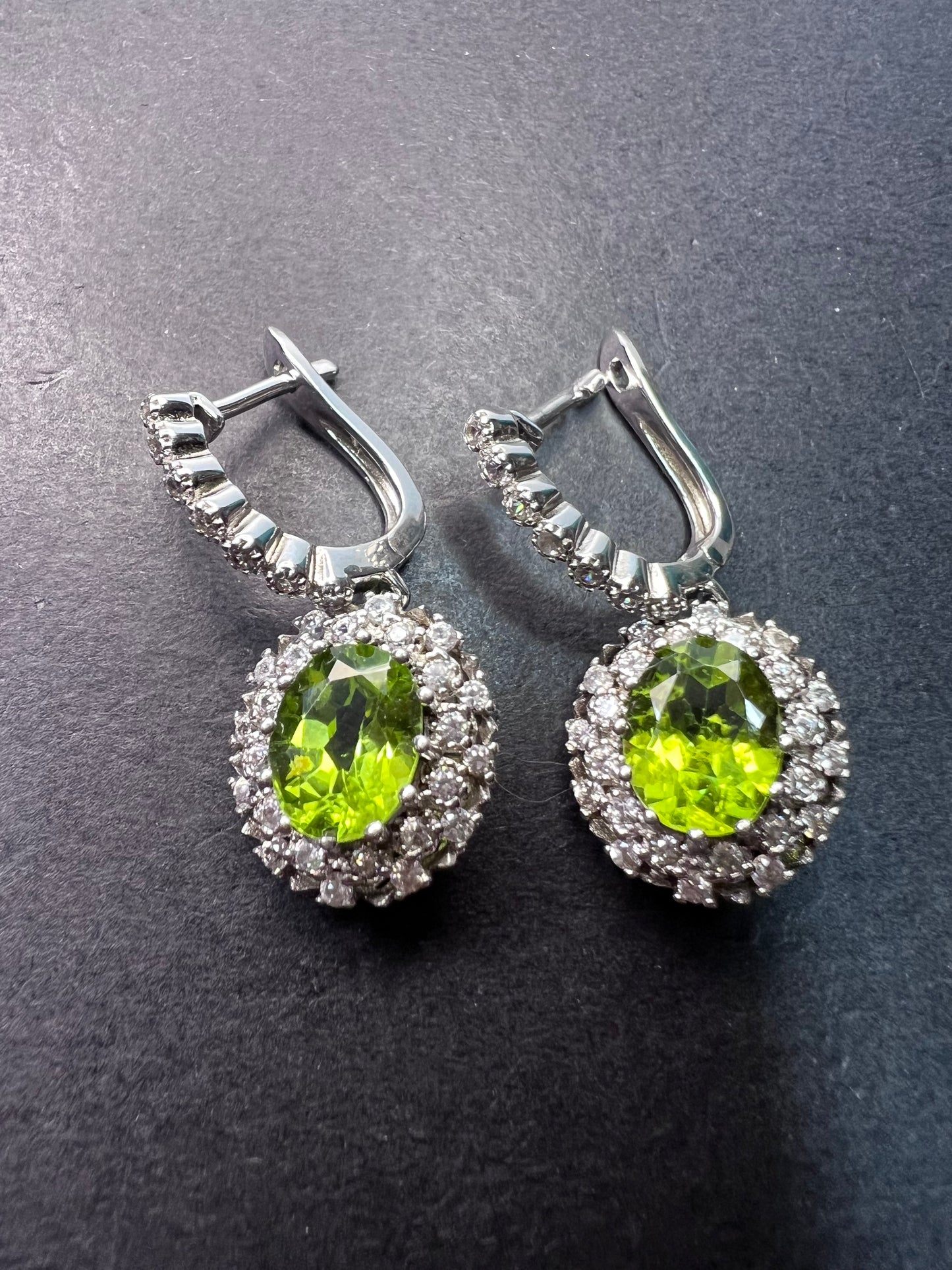 Manchurian Peridot and zircon drop halo earrings in rhodium over sterling silver 5.42 ctw