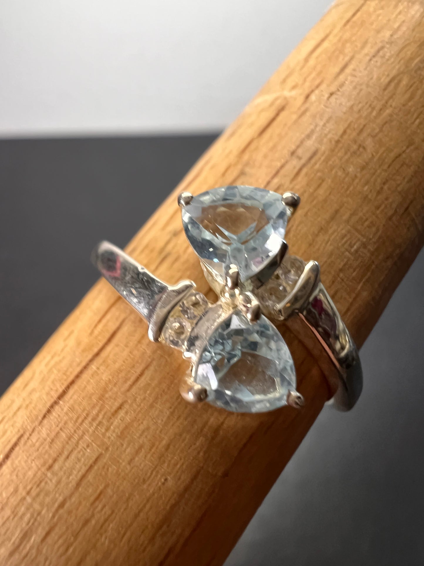 Trillium cut blue topaz bypass ring in rhodium over sterling silver size 9