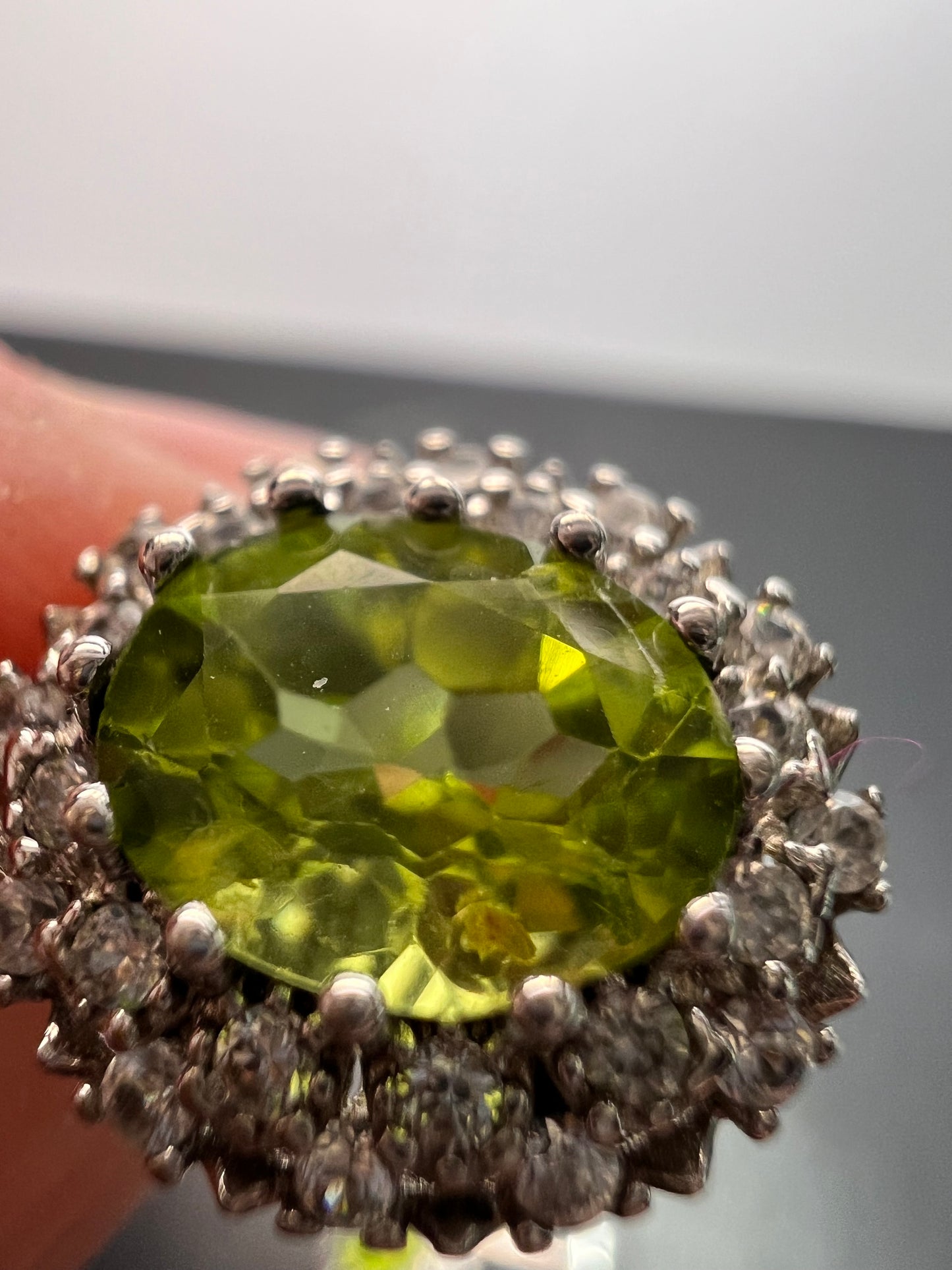 Manchurian Peridot and zircon drop halo earrings in rhodium over sterling silver 5.42 ctw