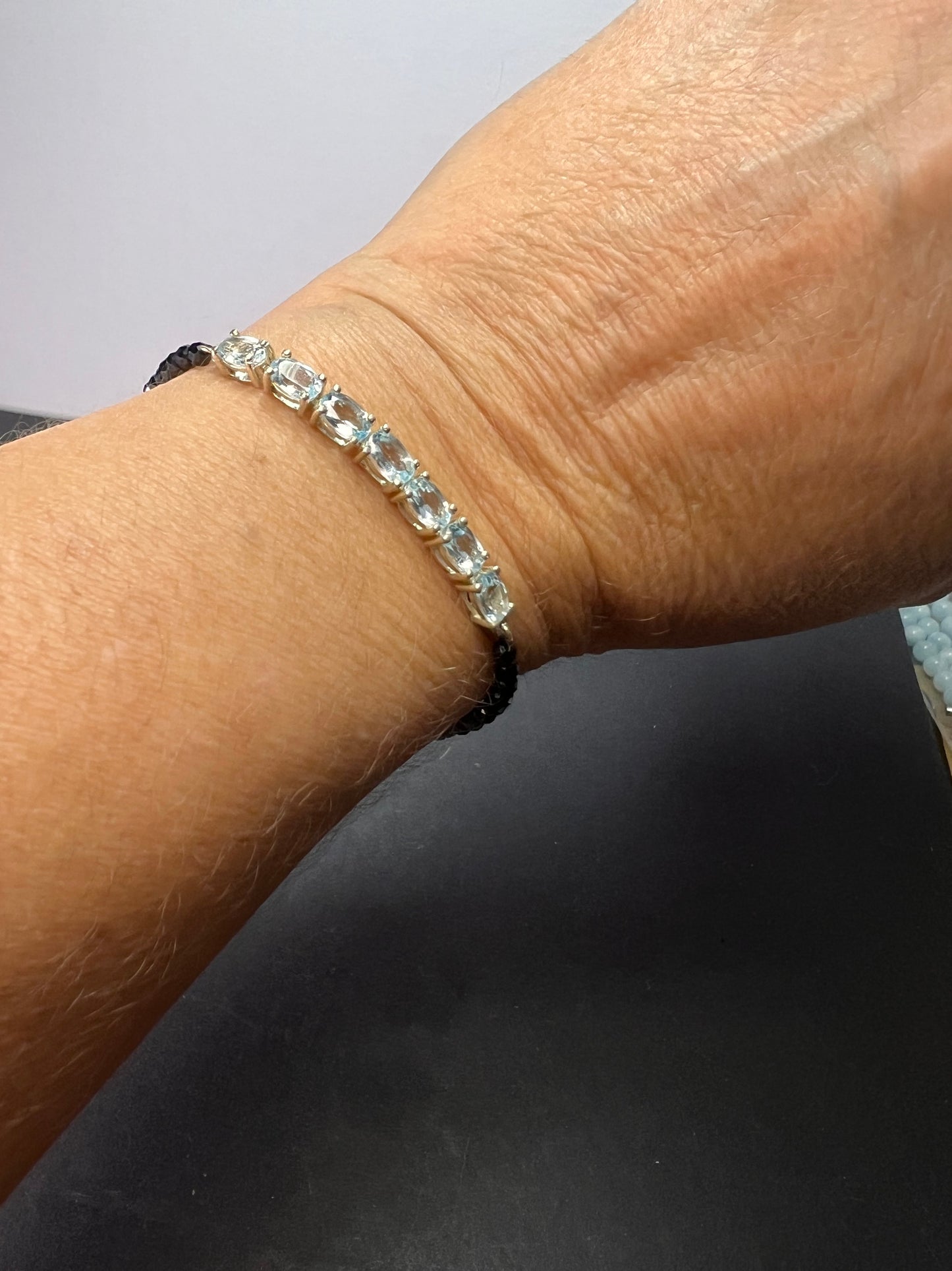 Black spinel and blue topaz bracelet with sterling lobster clasp
