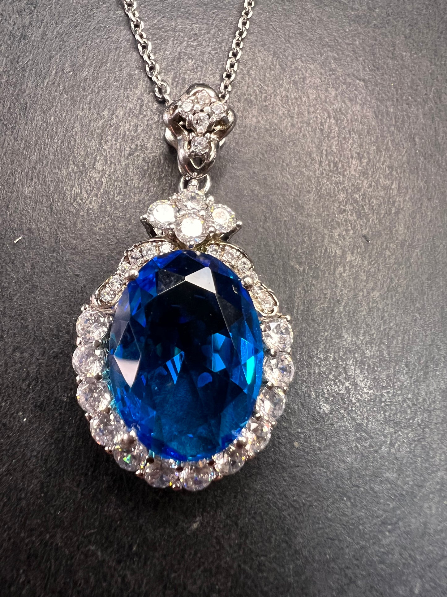 Blue and white CZ sterling silver halo pendant