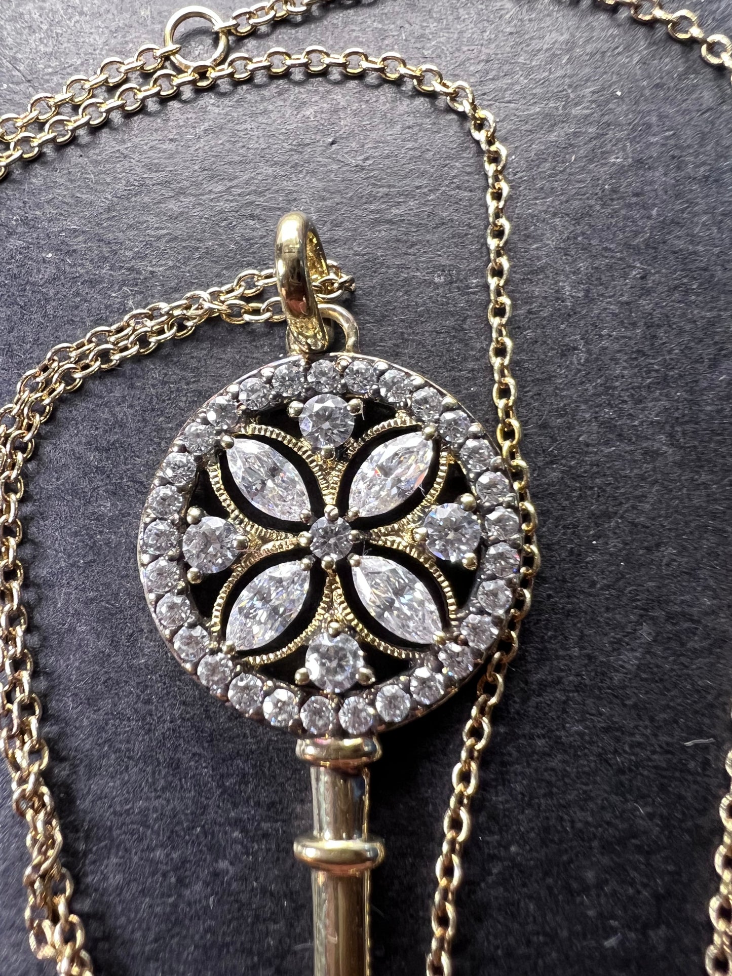 Gold over sterling silver key pendant necklace with Cz stones