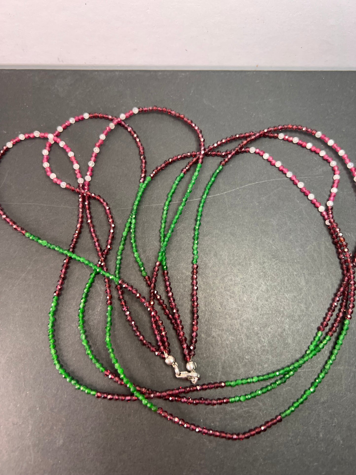 Emerald multi stone three strand necklace 25”