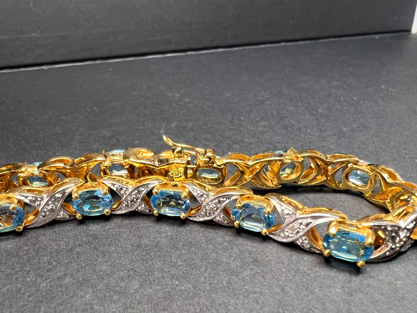 Vintage blue topaz and diamond gold over sterling silver tennis bracelet