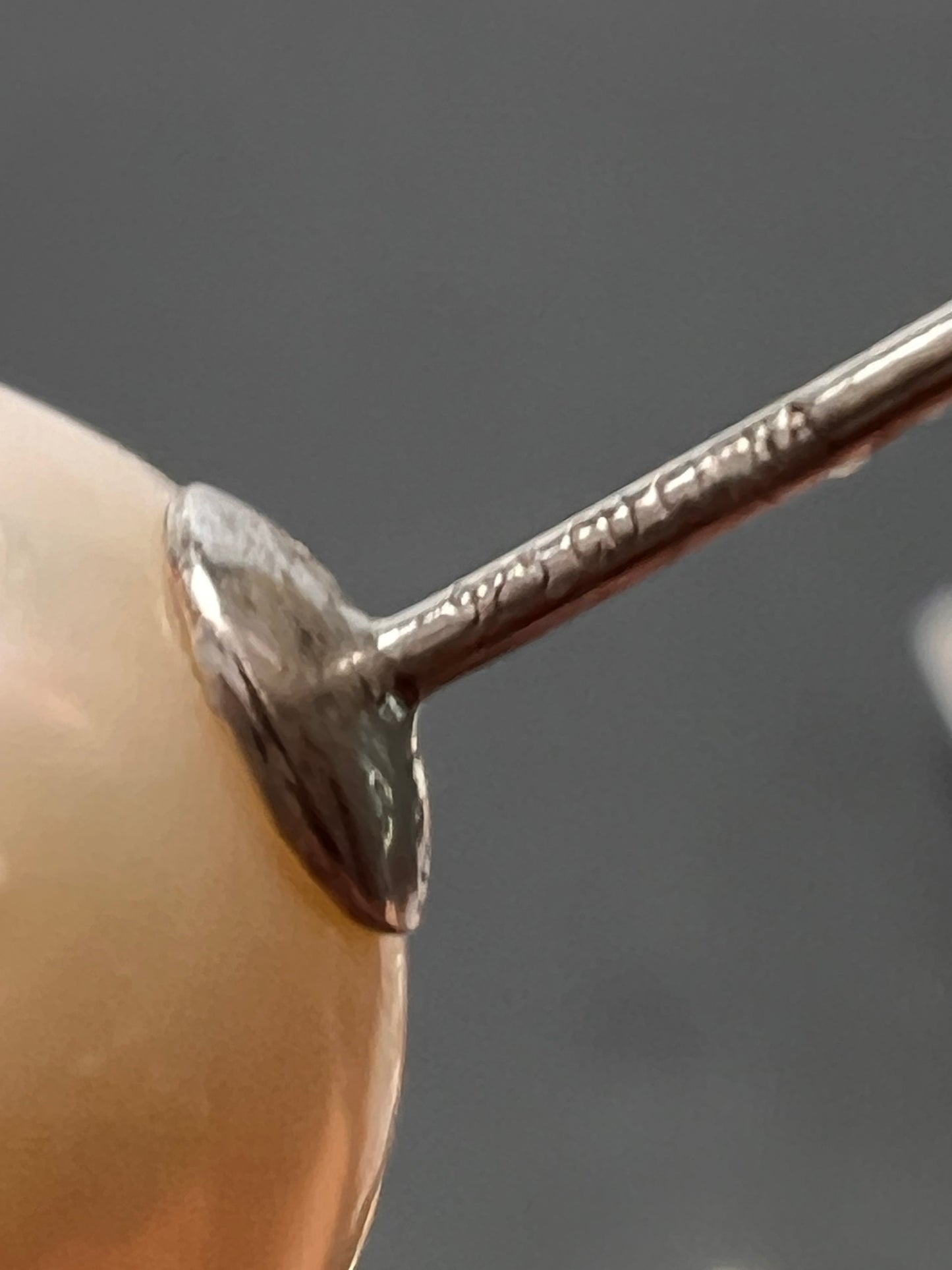 Graduated dangling pearl earrings in sterling silver