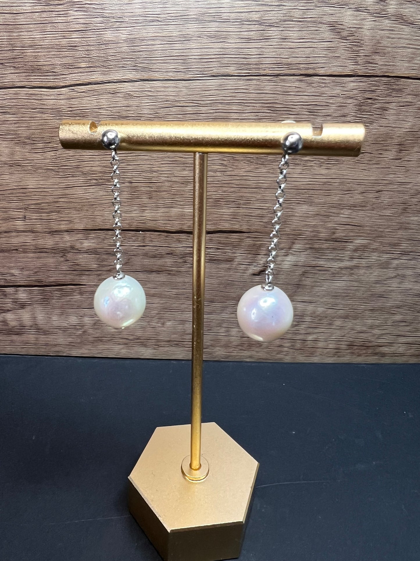 12mm white cultured pearl dangle earrings in sterling silver