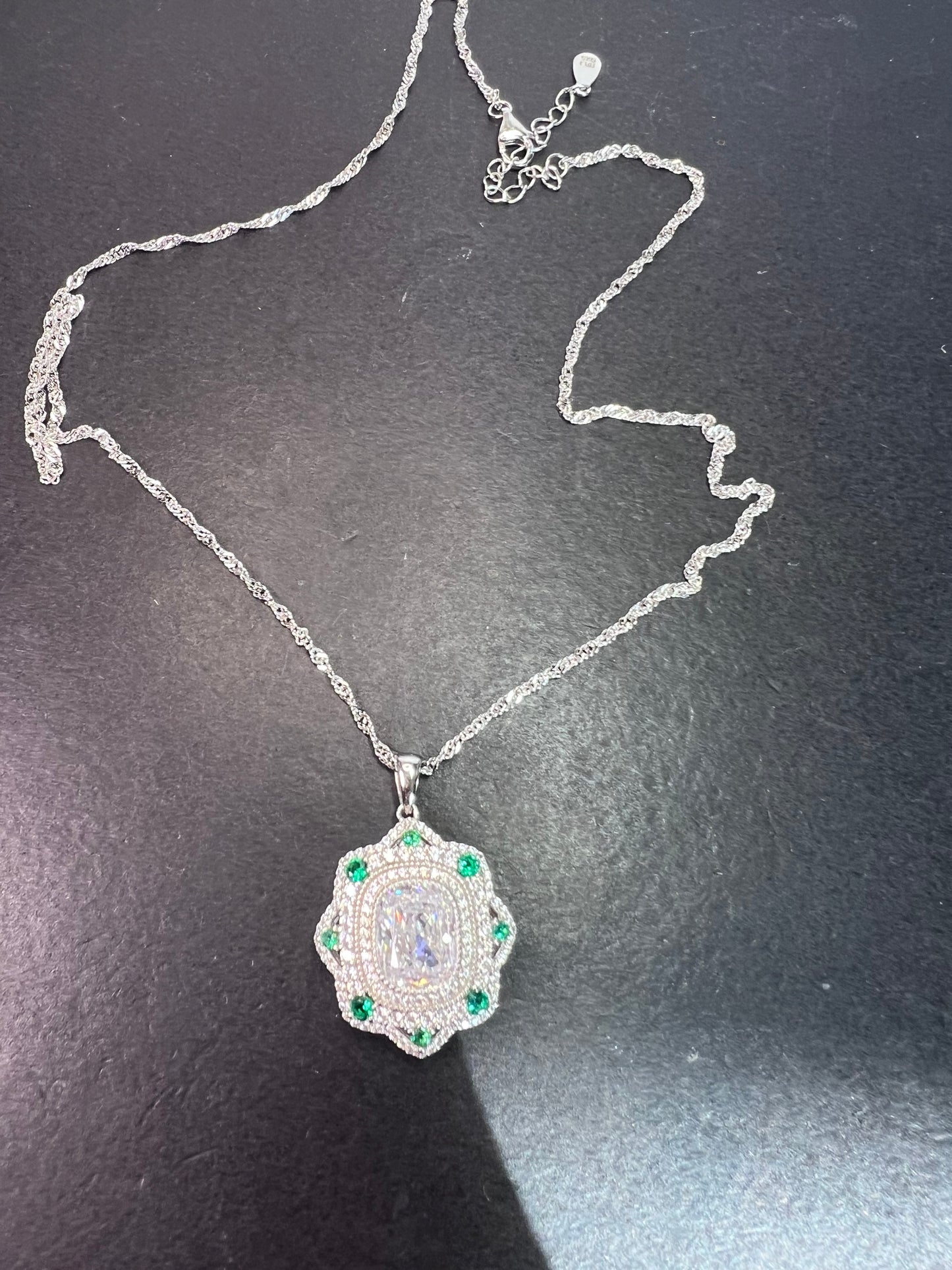 Bella Luce lab created green spinel and diamond simulant rhodium over sterling silver pendant with 18 inch chain necklace