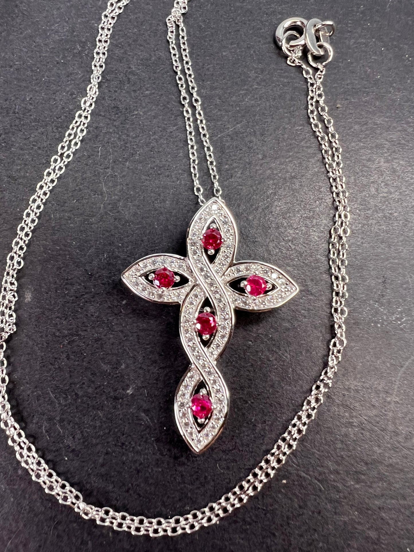 Lab grown ruby and CZ cross pendant and chain necklace in rhodium over sterling silver 18 inch