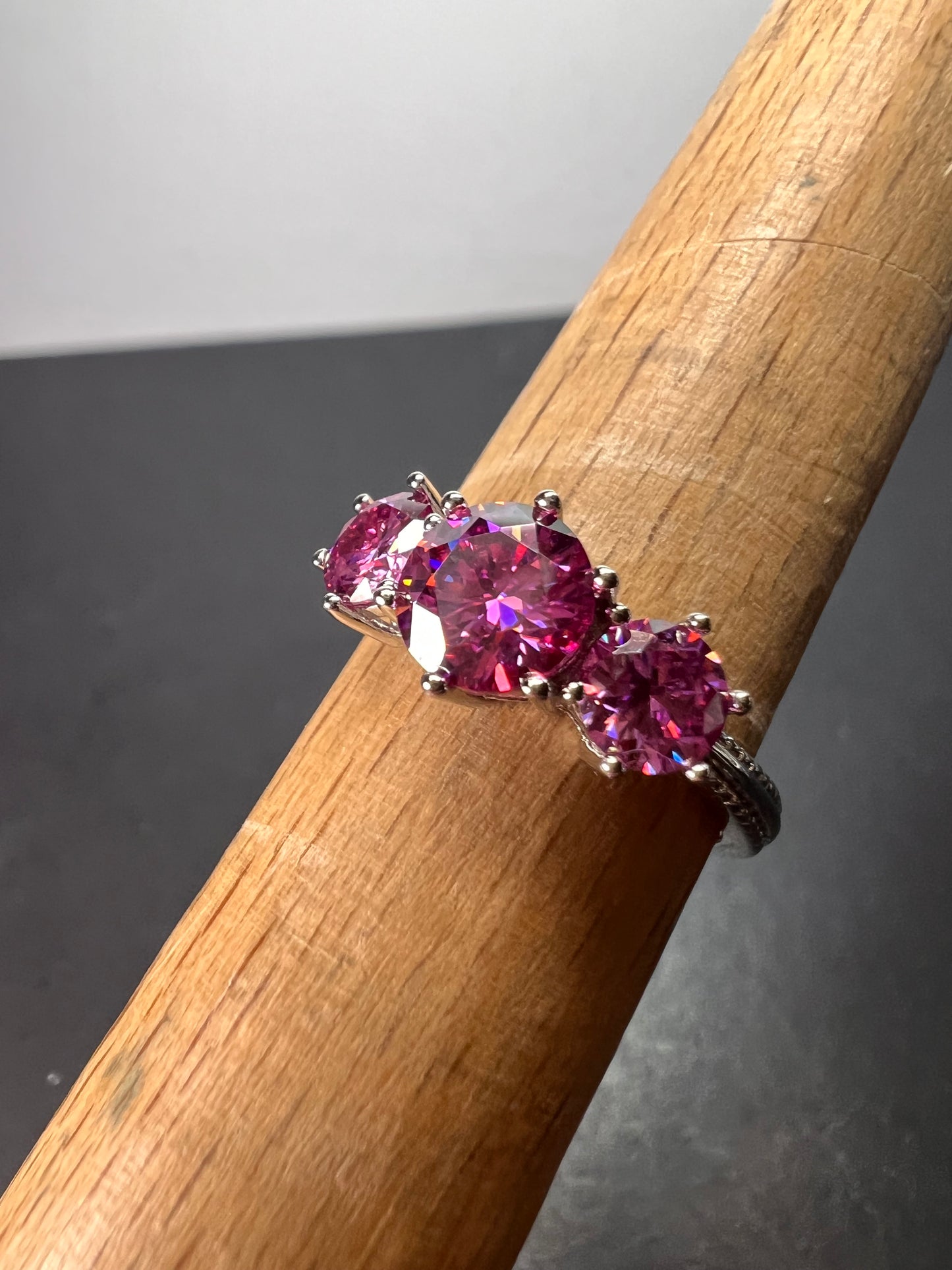 Pink moissanite trilogy ring in platinum over sterling silver size 7