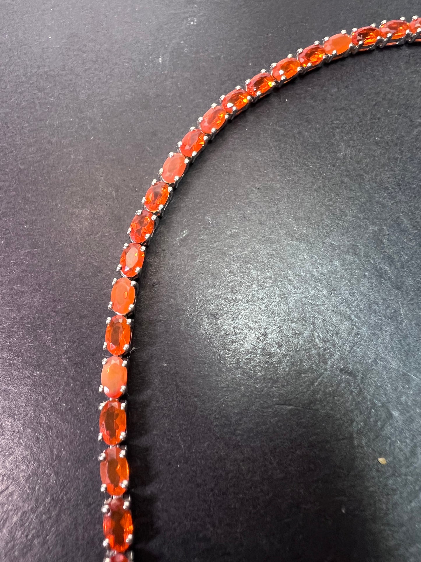 Mexican fire opal rhodium over sterling silver tennis bracelet