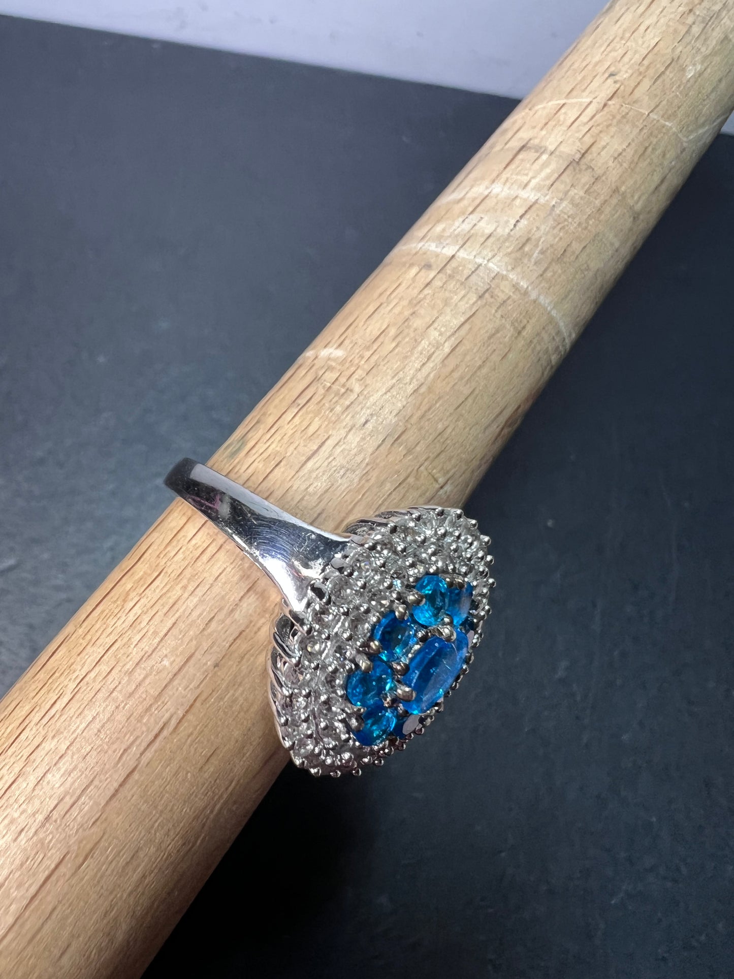 Neon blue apatite and white spinel halo cocktail ring in sterling silver size 9