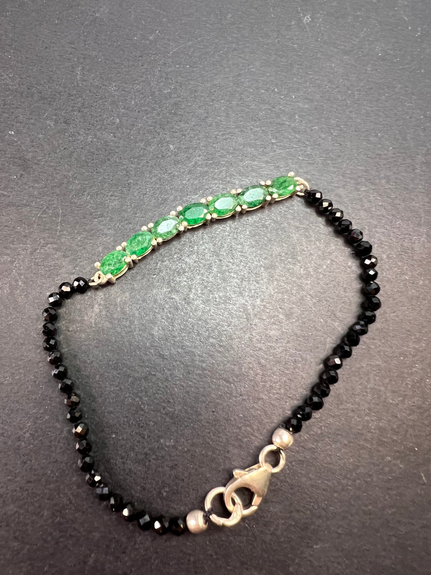 Black spinel and emerald sterling silver bracelet