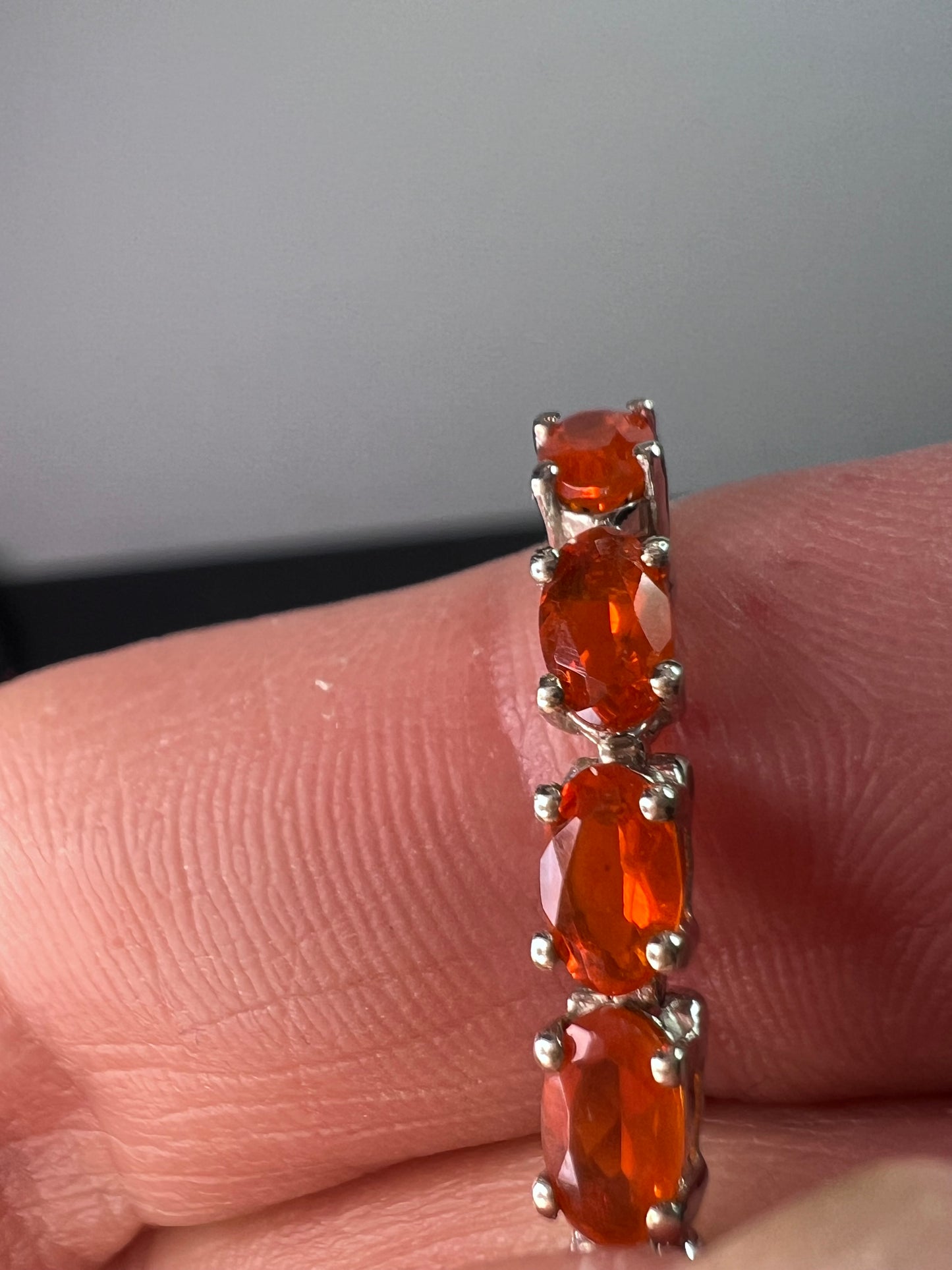 Mexican fire opal rhodium over sterling silver tennis bracelet