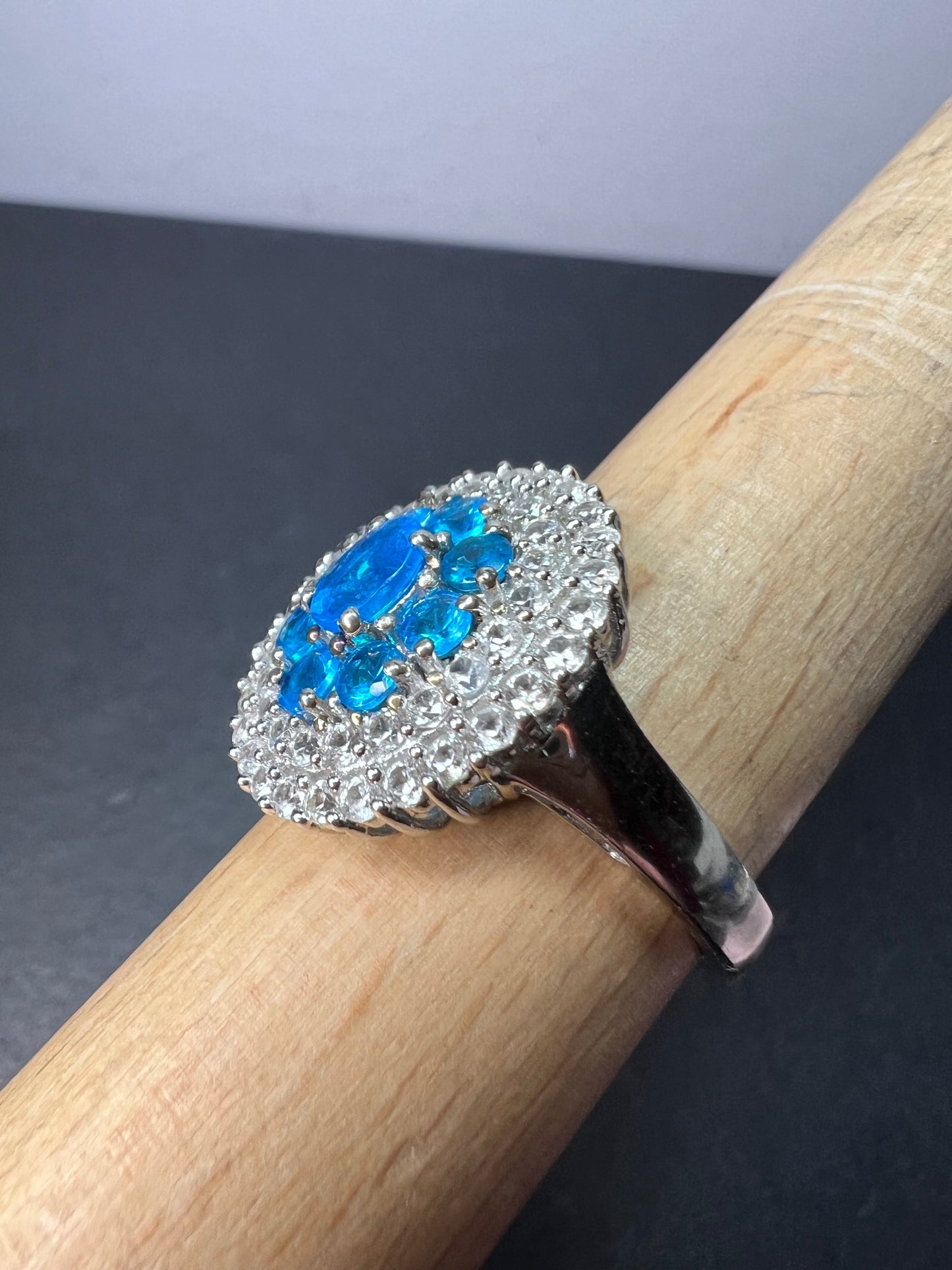 Neon blue apatite and white spinel halo cocktail ring in sterling silver size 9