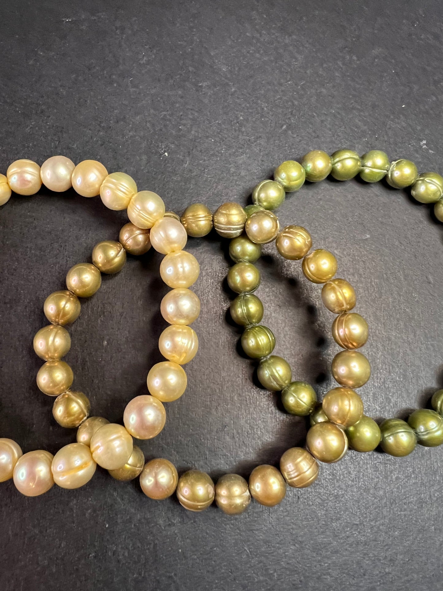 Set of three freshwater pearl shades of green stretch bracelets