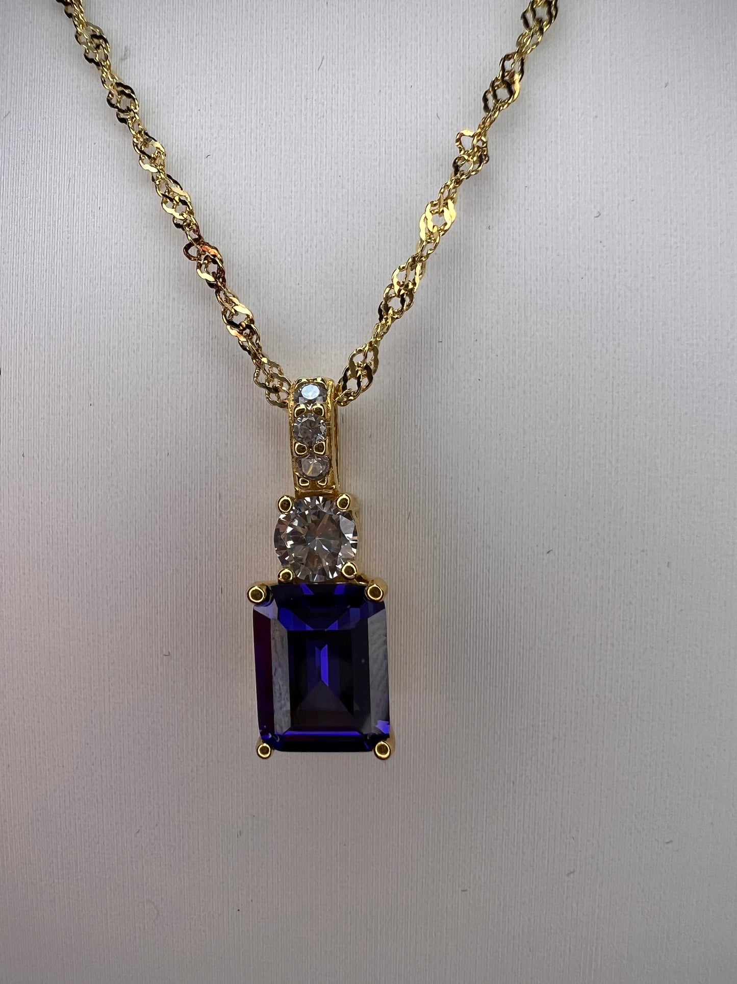 Blue emerald cut CZ pendant and chain necklace in gold over sterling silver 18 inches