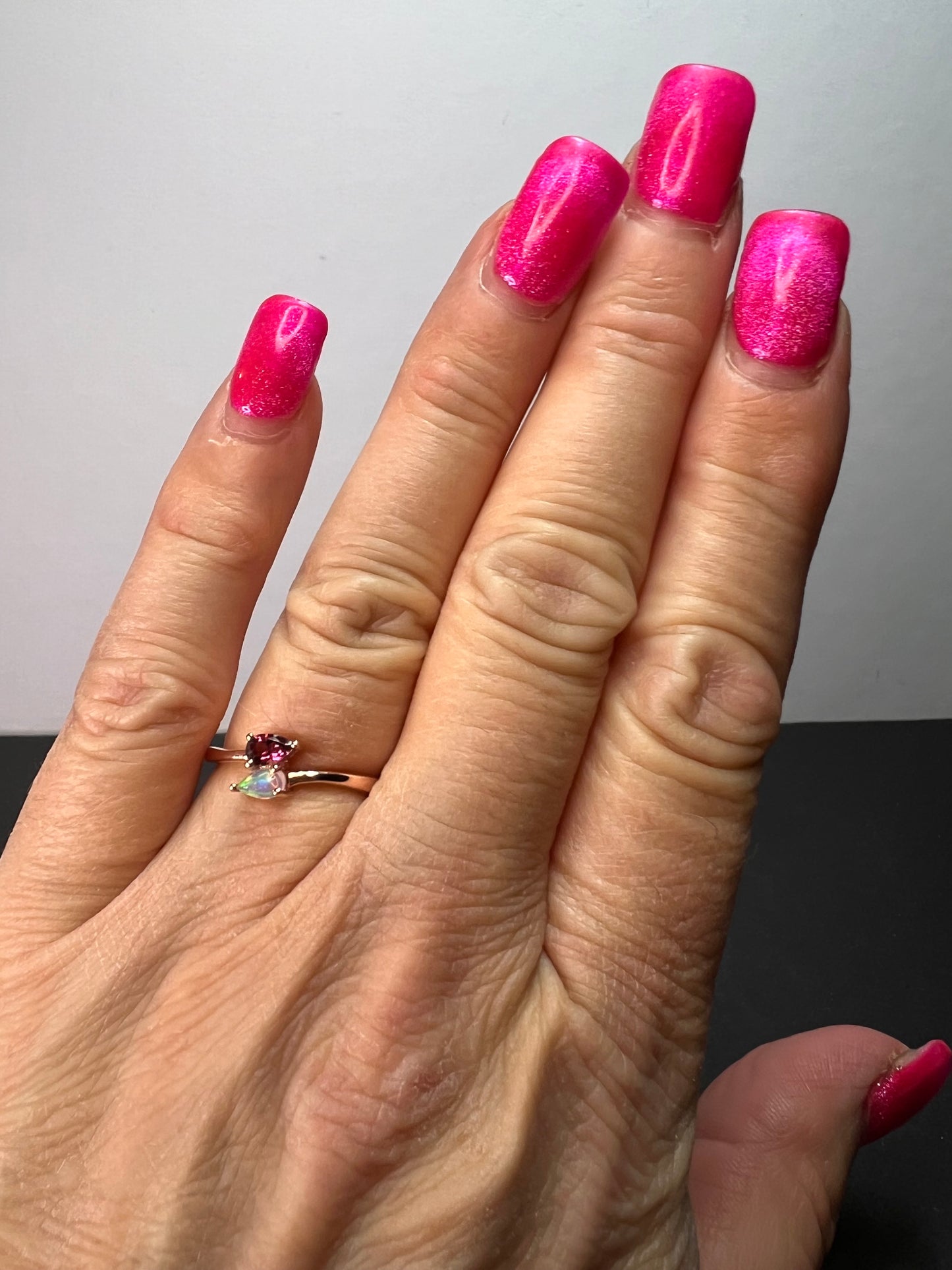 Rubellite and Ethiopian welo opal bypass ring in rose gold vermeil over sterling silver size 7. .35ctw