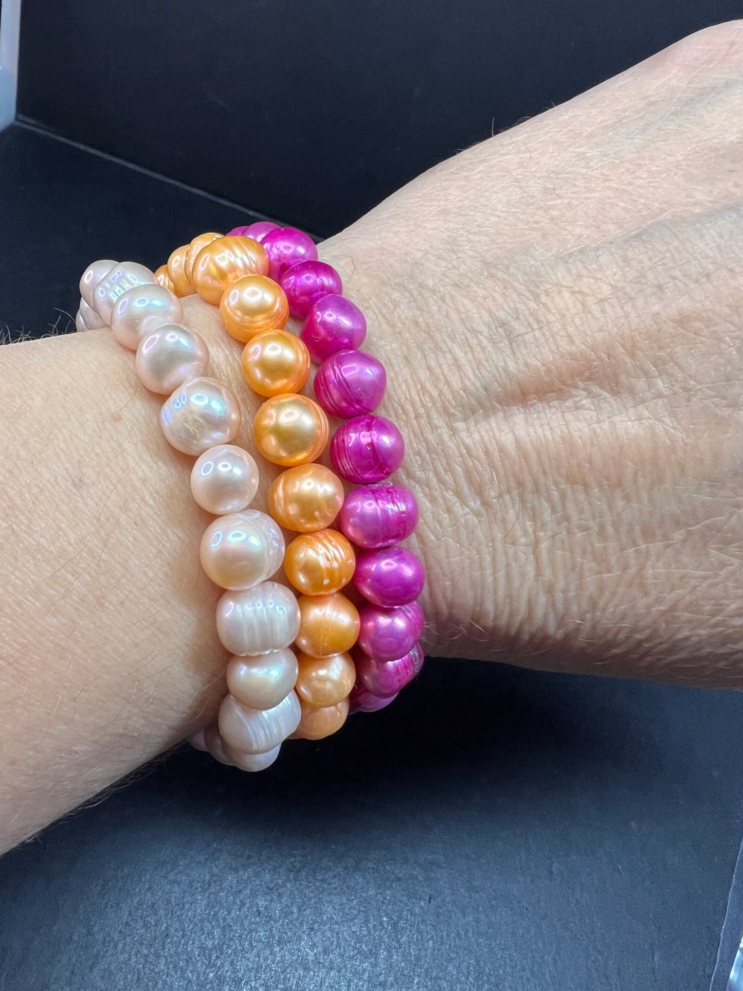 Set of three freshwater pearl stretch bracelets fuchsia pink to tangerine