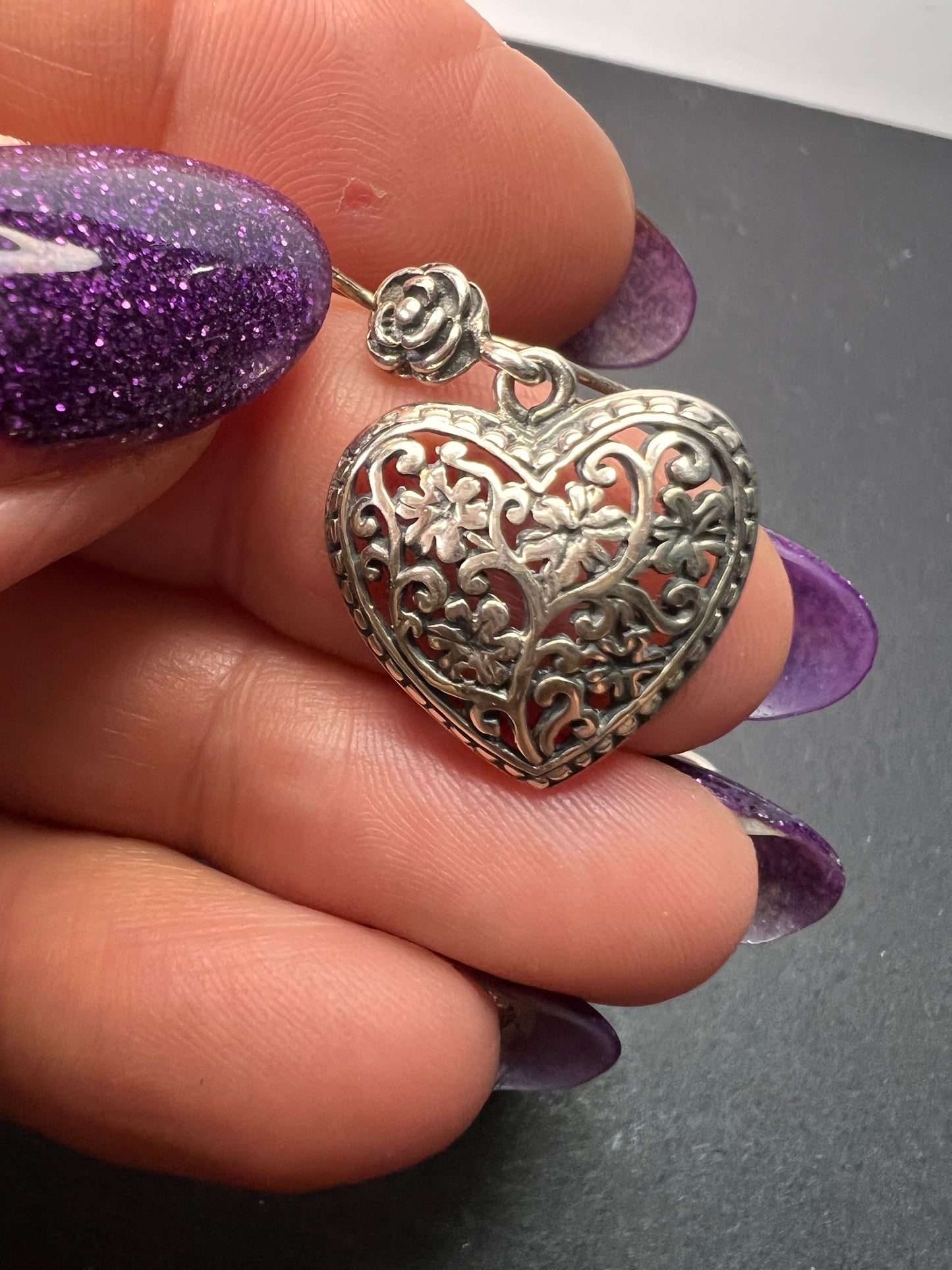 Sterling silver heart shaped earrings with floral design