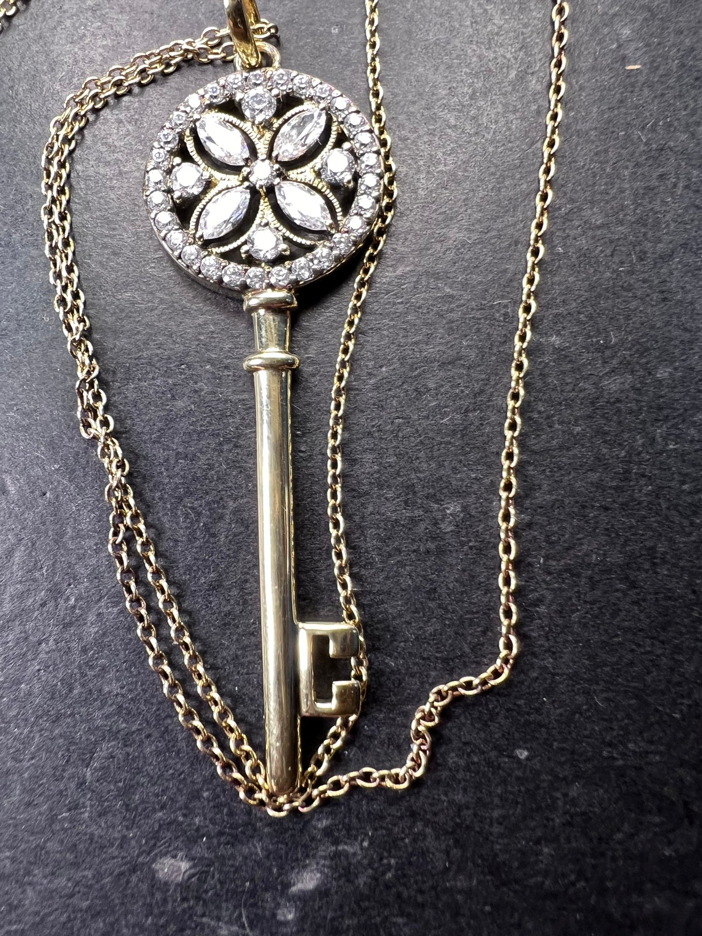 Gold over sterling silver key pendant necklace with Cz stones