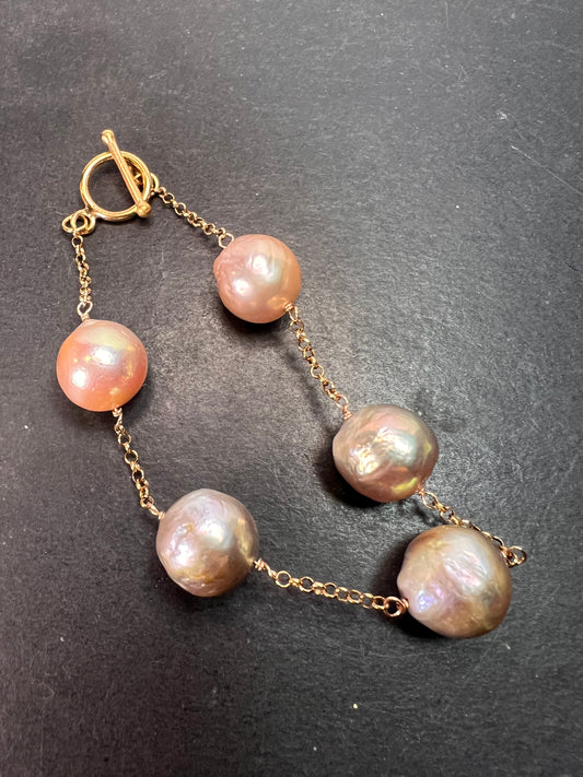 Multi colored baroque pearl station bracelet in rose gold over Sterling silver