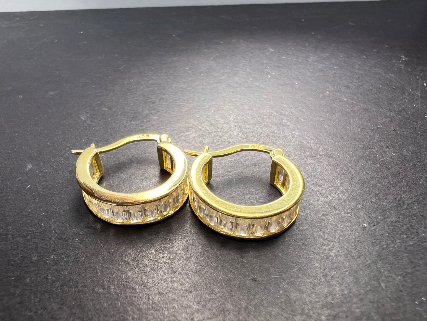 CZ huggie hoop earrings in yellow gold over sterling silver