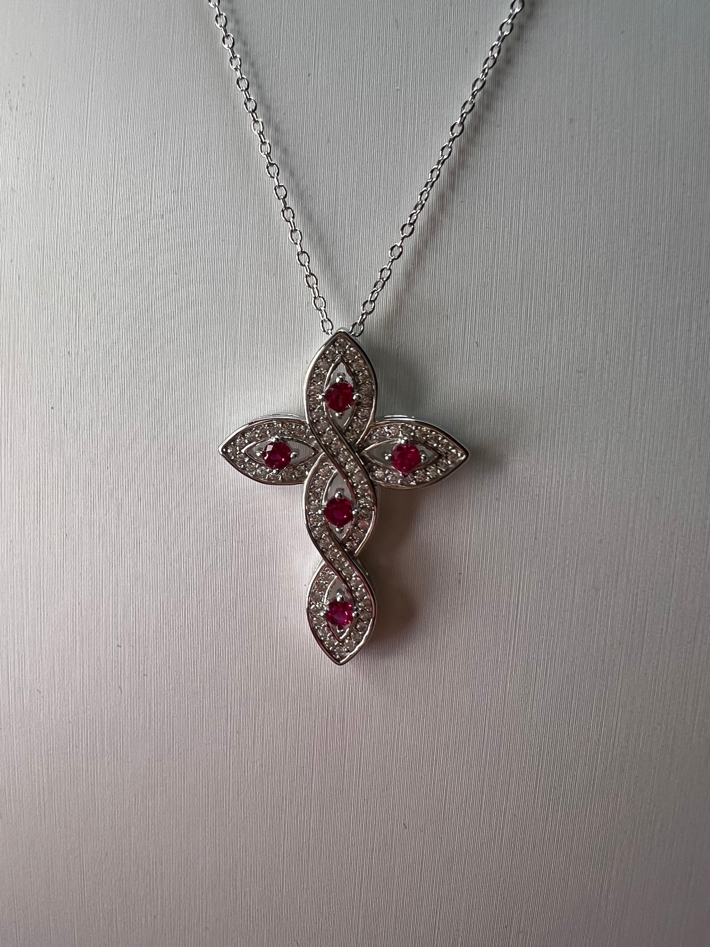 Lab grown ruby and CZ cross pendant and chain necklace in rhodium over sterling silver 18 inch