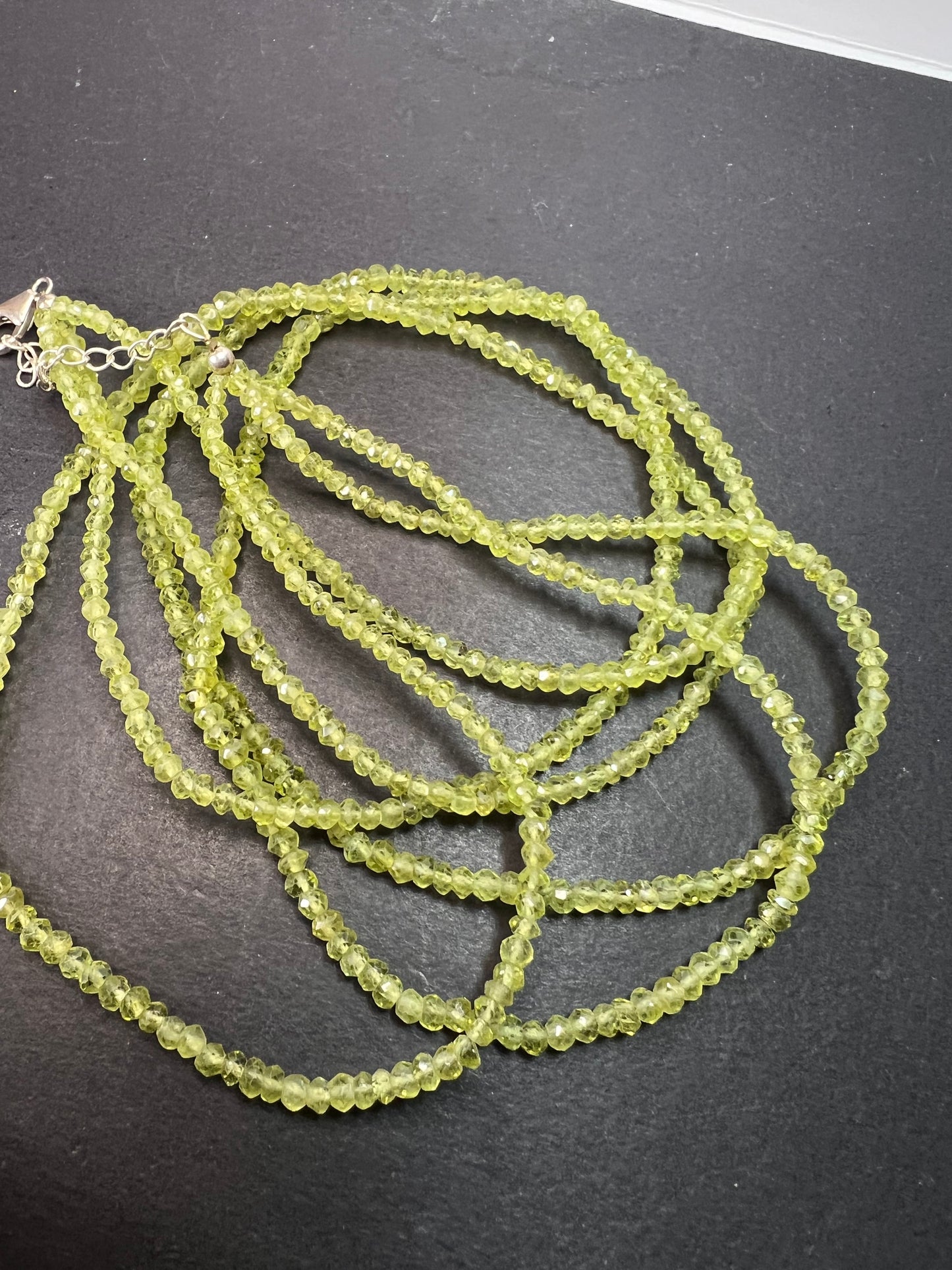 Layered peridot necklace with sterling silver clasp