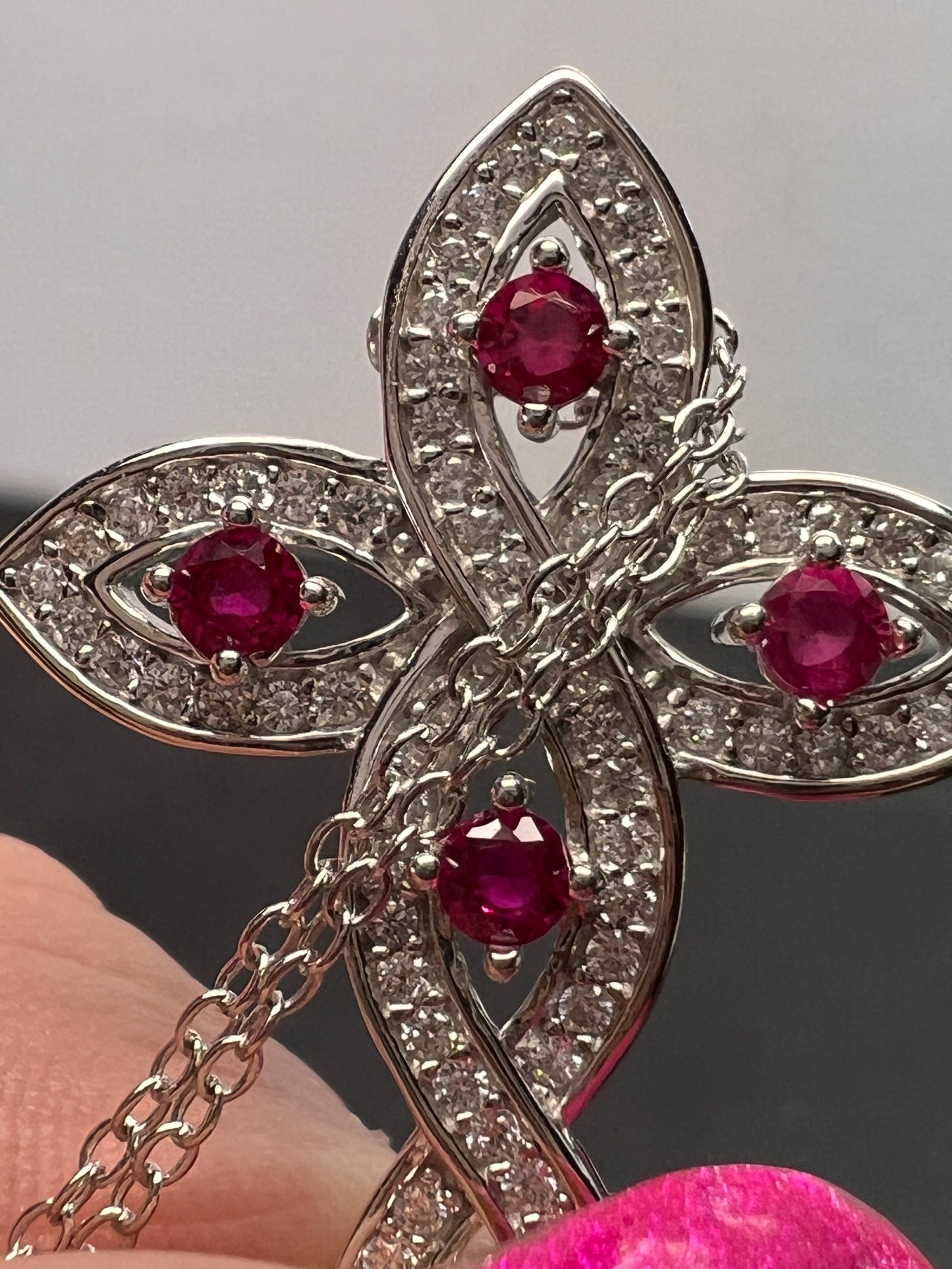 Lab grown ruby and CZ cross pendant and chain necklace in rhodium over sterling silver 18 inch