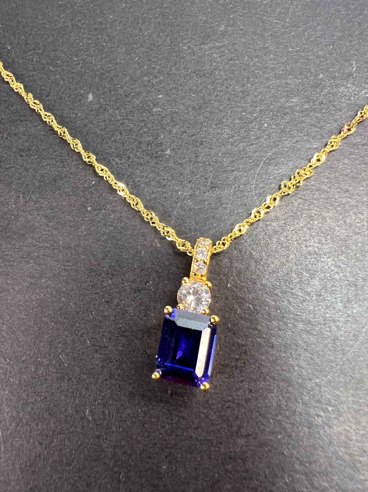 Blue emerald cut CZ pendant and chain necklace in gold over sterling silver 18 inches