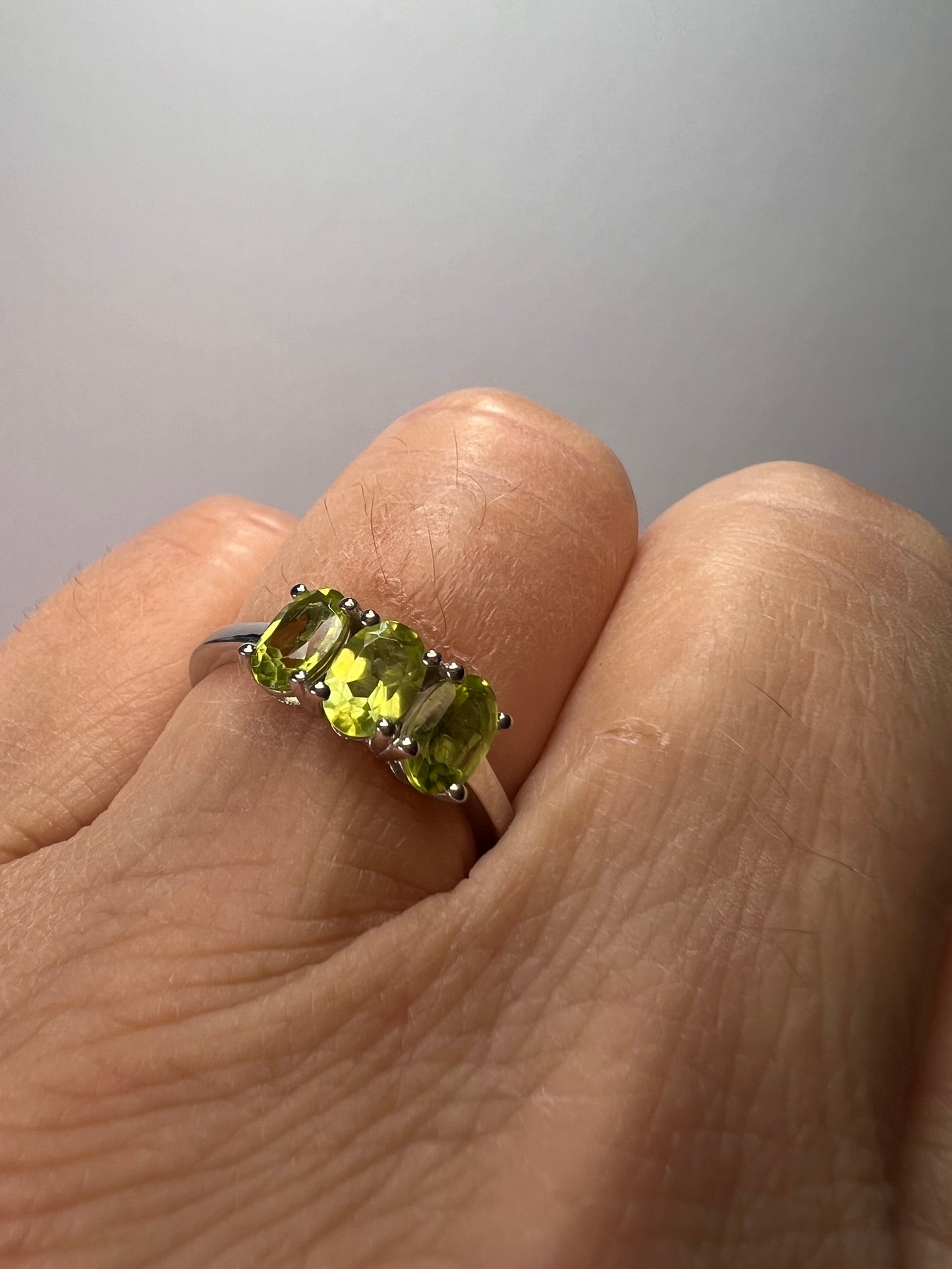 Peridot trilogy ring in platinum over Sterling silver size 7 *NEW*