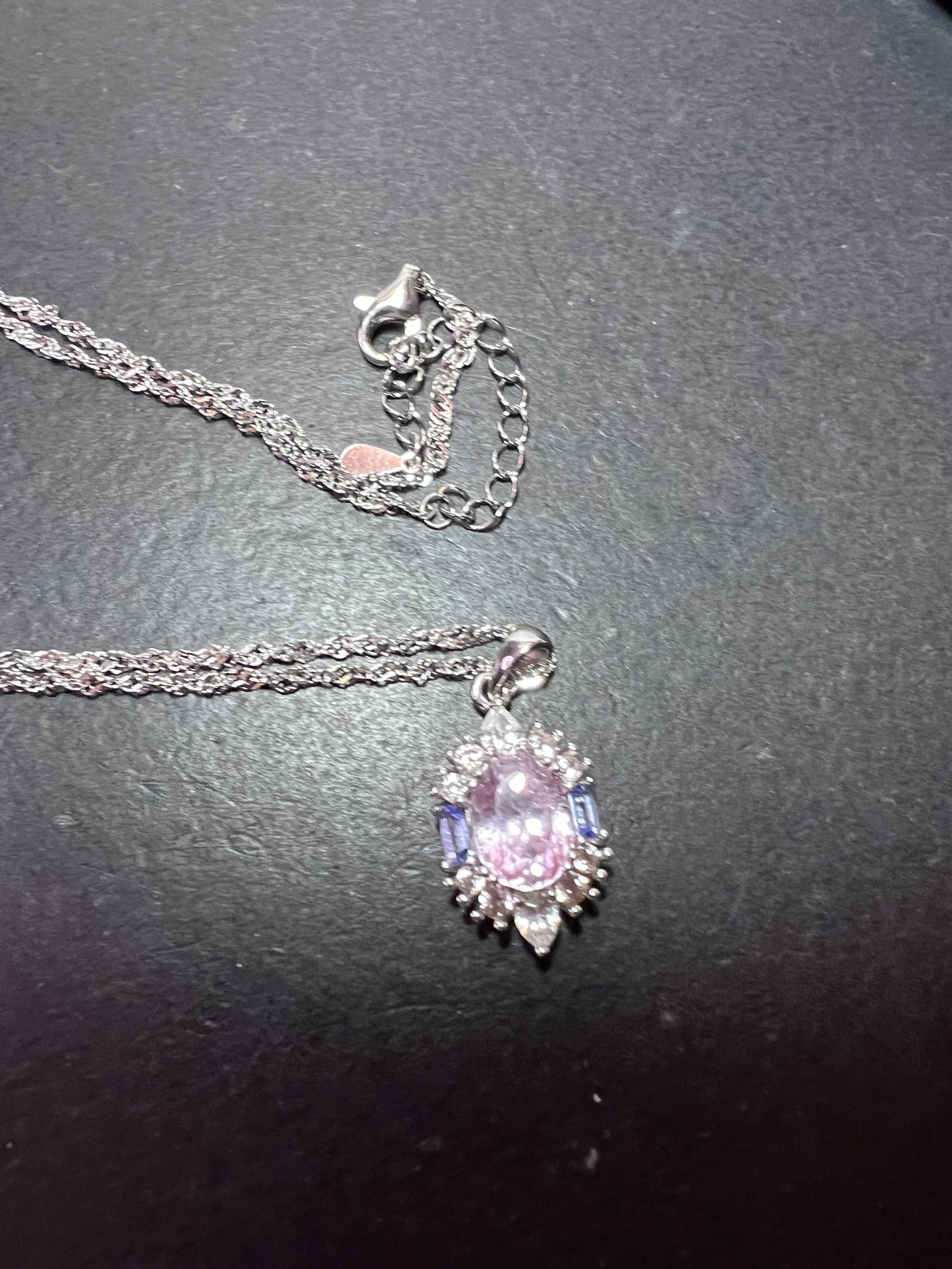 2.11ct Kunzite, 0.18ctw Tanzanite And 0.87ctw White Zircon Rhodium Over Silver halo Pendant With Chain