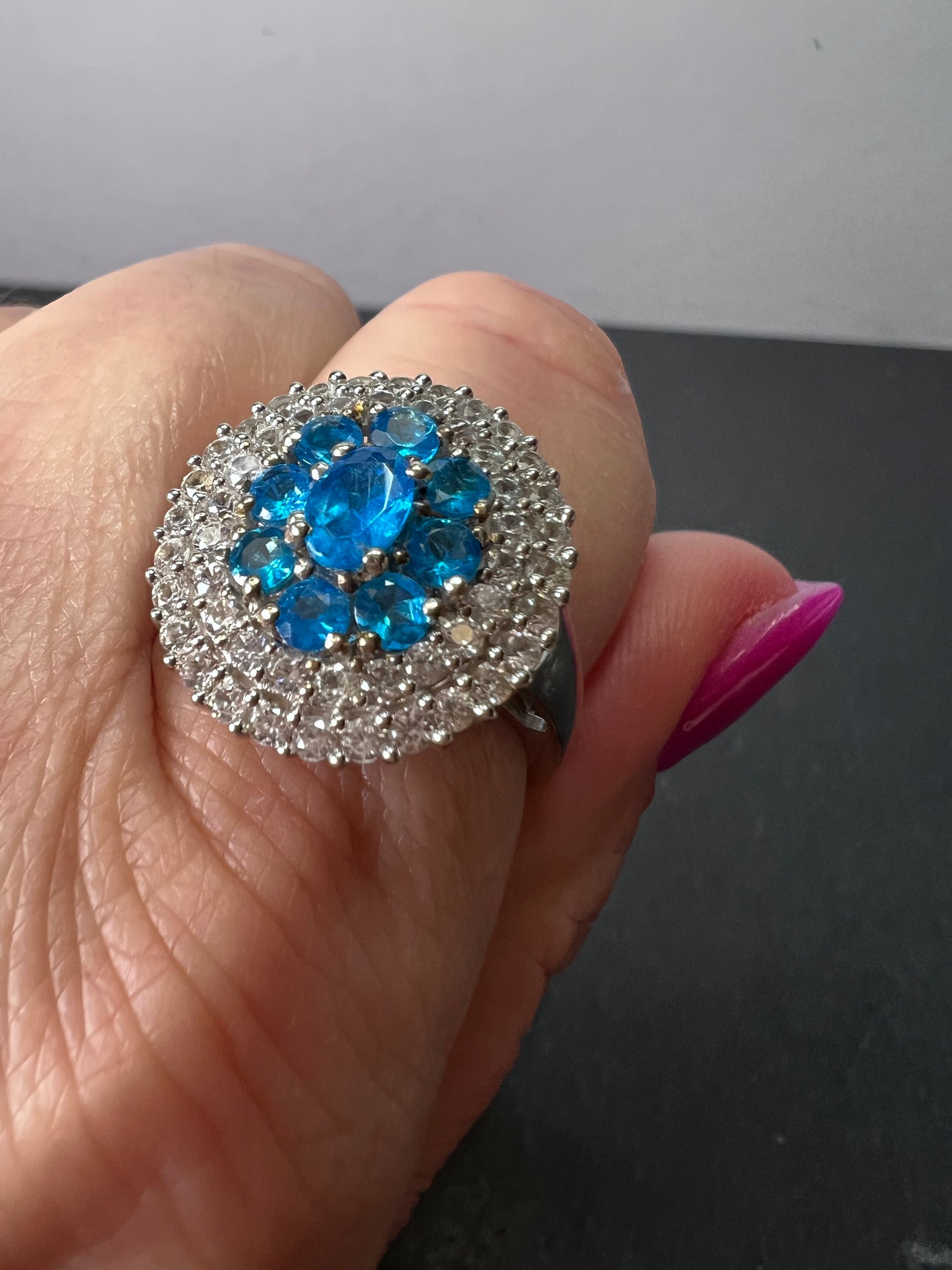 Neon blue apatite and white spinel halo cocktail ring in sterling silver size 9