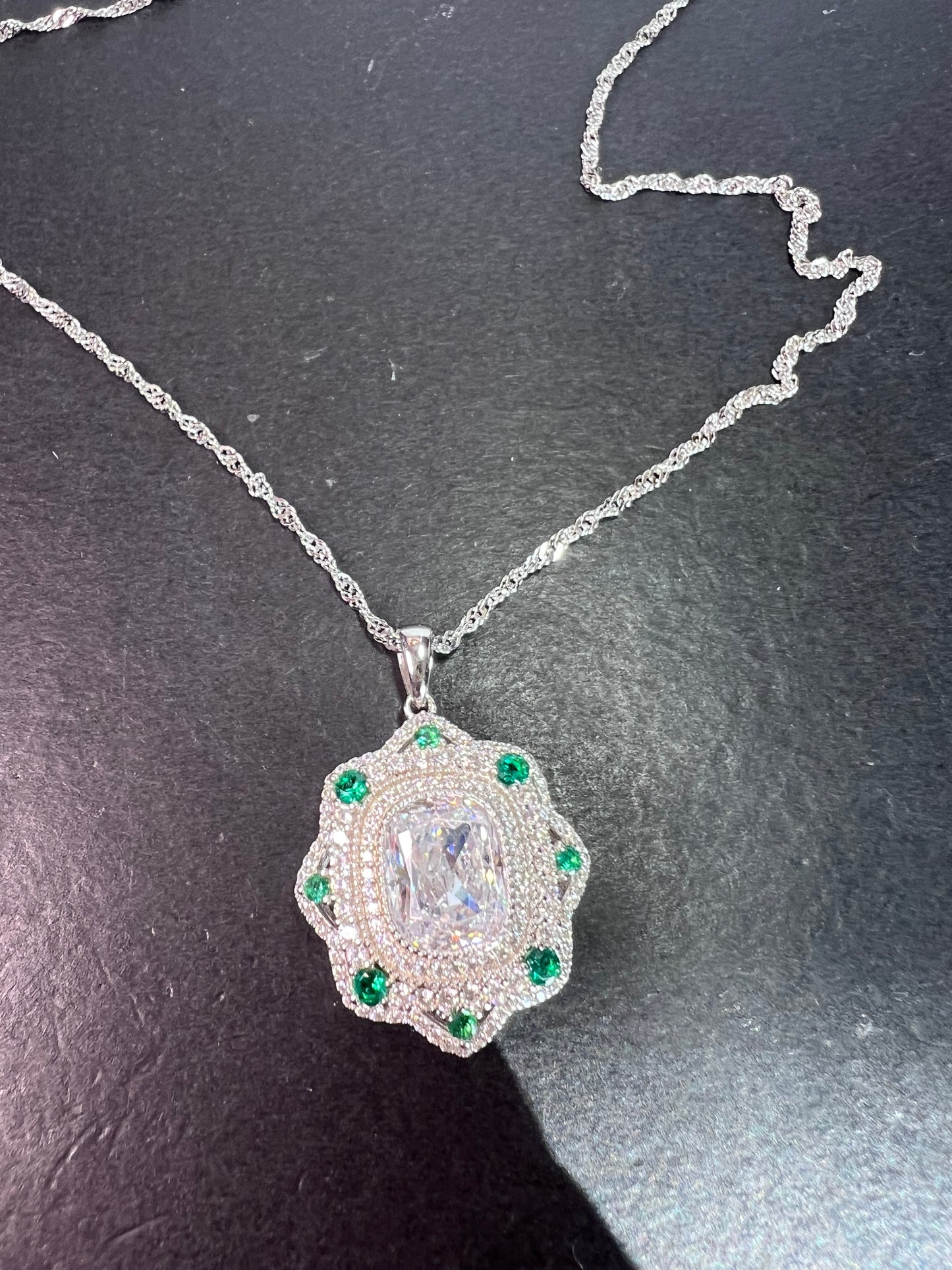 Bella Luce lab created green spinel and diamond simulant rhodium over sterling silver pendant with 18 inch chain necklace